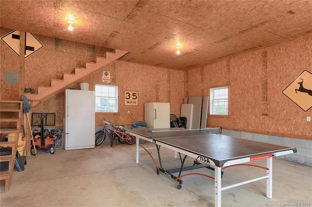 166 Stikeleather Road Stony Point, NC 28678 - Photo 38 of 48 a room with table chairs and windows