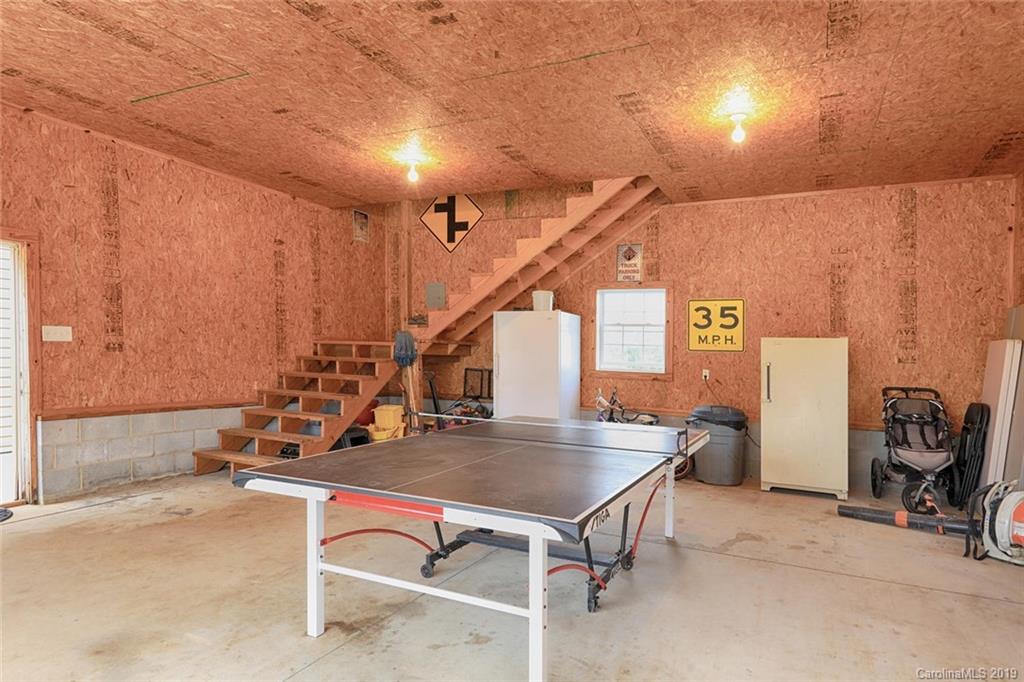 166 Stikeleather Road Stony Point, NC 28678 - Photo 39 of 48 a room with table chairs and windows