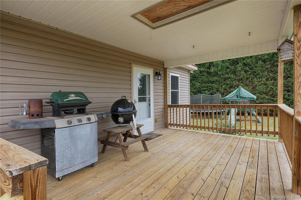 166 Stikeleather Road Stony Point, NC 28678 - Photo 43 of 48 a view of a balcony with furniture and wooden floor