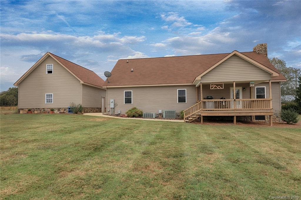 166 Stikeleather Road Stony Point, NC 28678 - Photo 45 of 48 a view of a house with a yard and sitting area