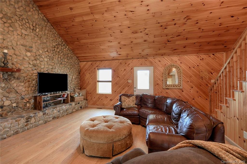 166 Stikeleather Road Stony Point, NC 28678 - Photo 6 of 48 a living room with furniture and a flat screen tv