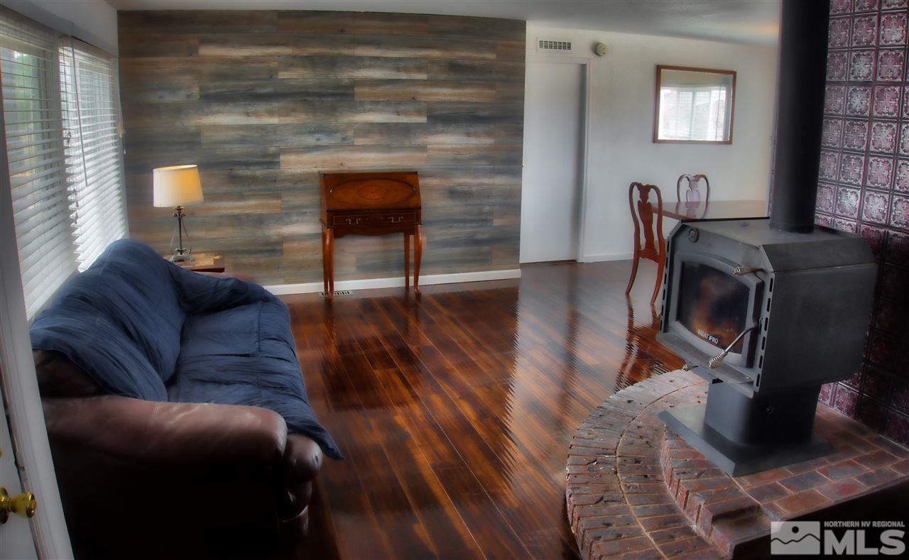 17745 Peacock Place Reno, NV 89508 - Photo 5 of 26 a living room with furniture and a fireplace