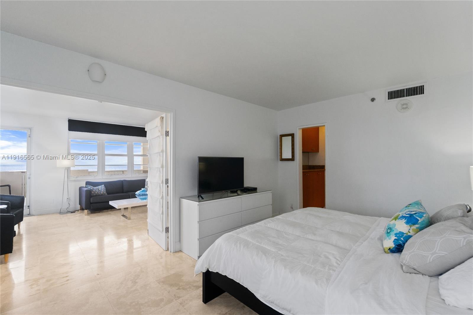 100 Lincoln Road, Unit 847 Miami Beach, FL 33139 - Photo 12 of 23 a bedroom with a bed and tv