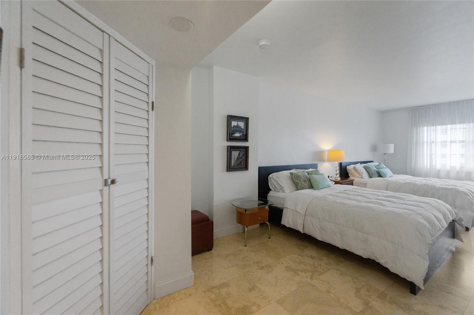 100 Lincoln Road, Unit 847 Miami Beach, FL 33139 - Photo 19 of 23 a bedroom with a bed and a night stand