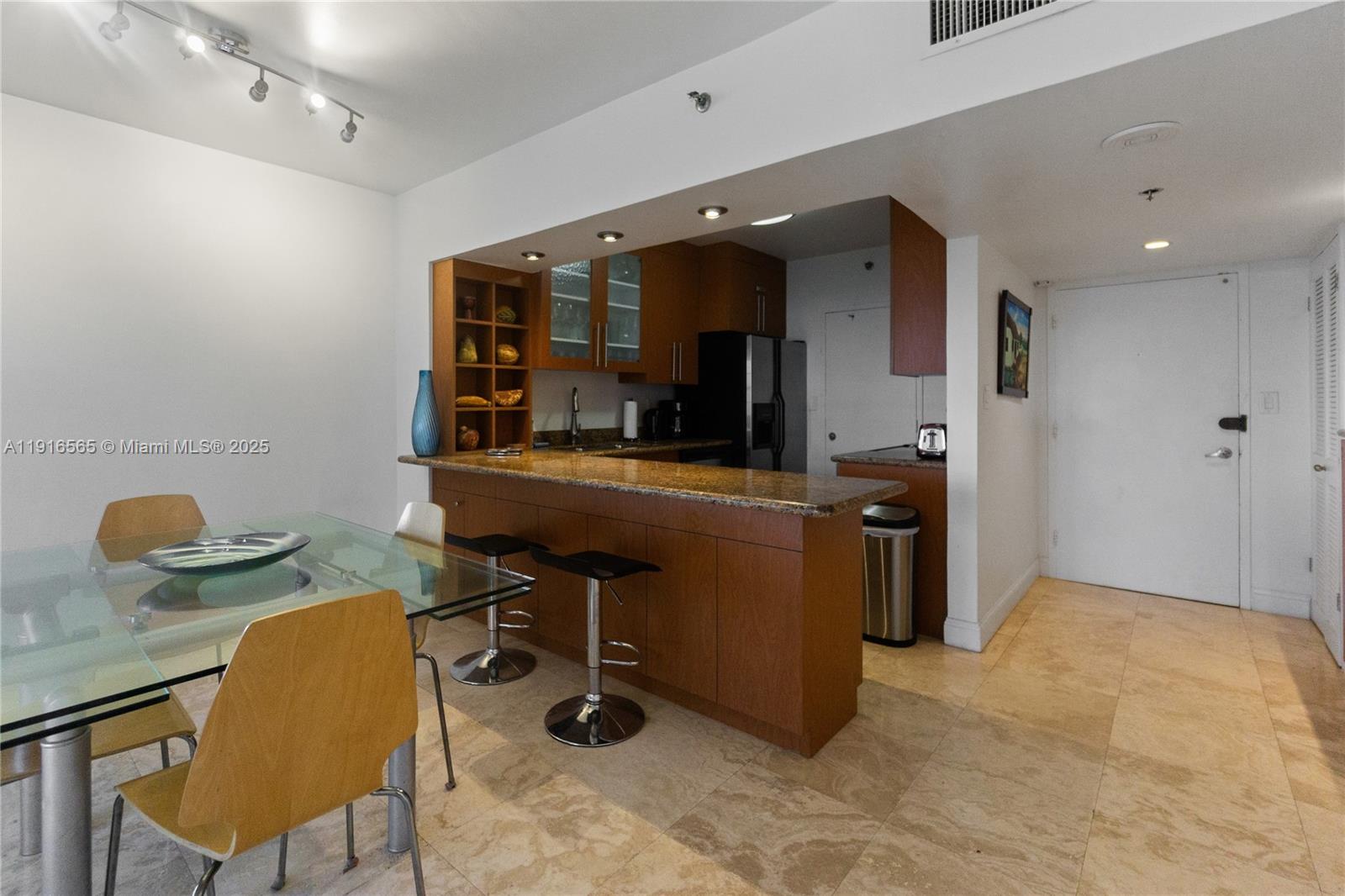 100 Lincoln Road, Unit 847 Miami Beach, FL 33139 - Photo 5 of 23 a view of a workspace with furniture and a mirror