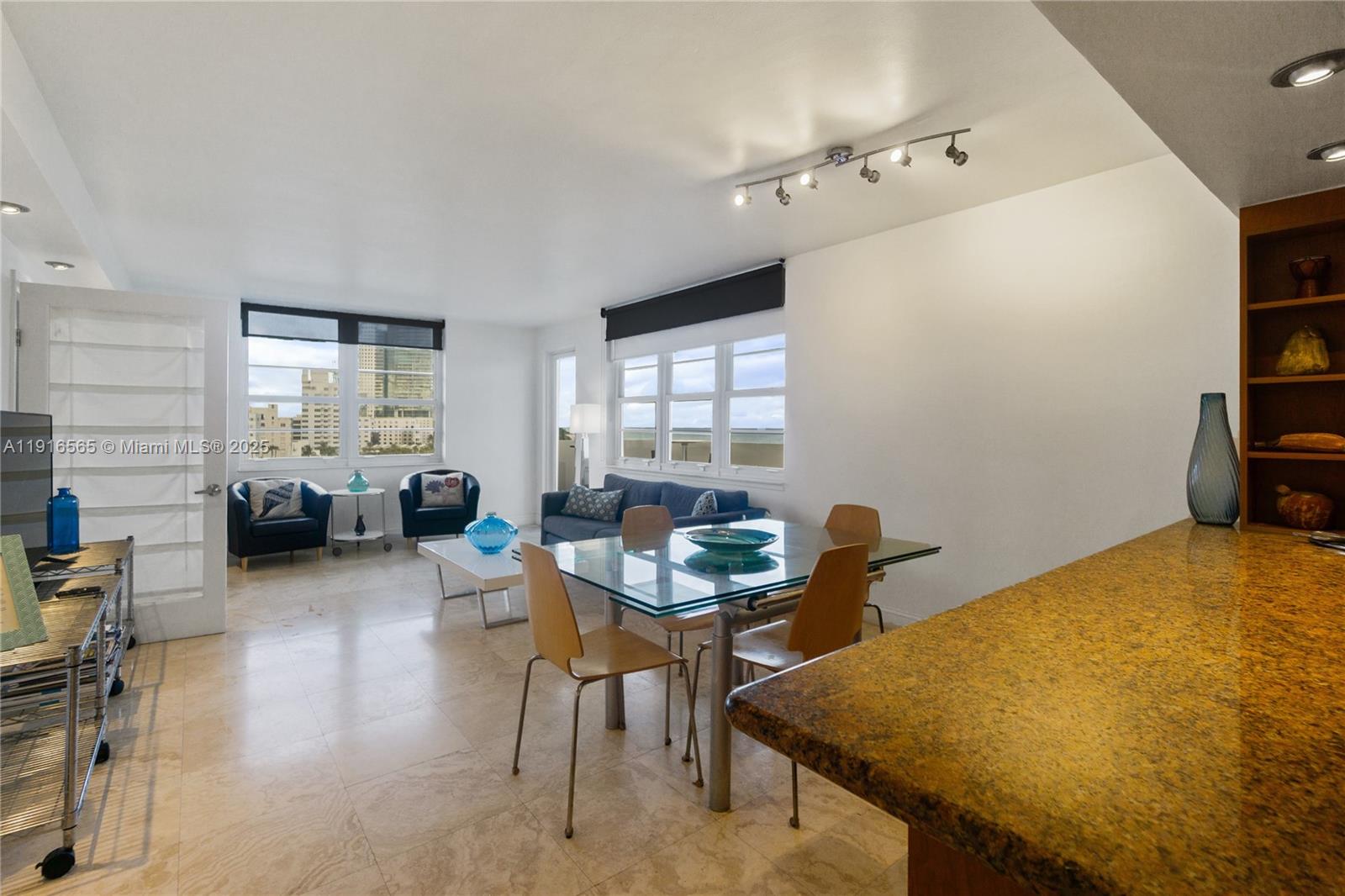 100 Lincoln Road, Unit 847 Miami Beach, FL 33139 - Photo 6 of 23 a living room with furniture and a window