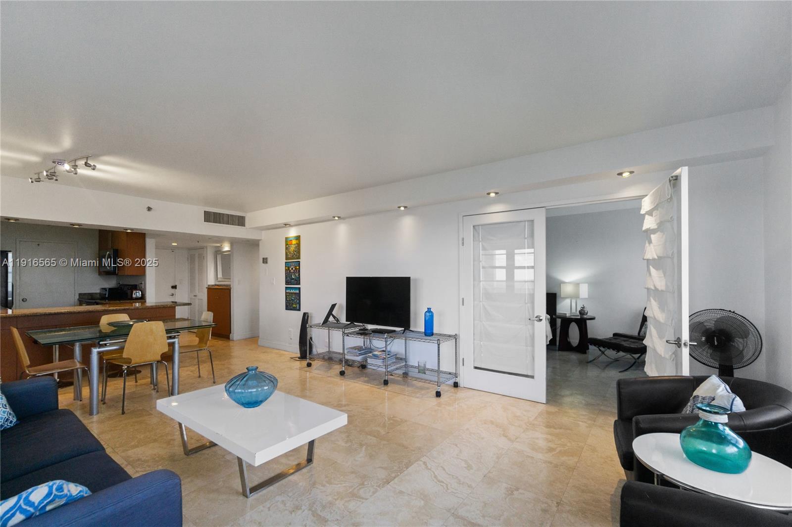 100 Lincoln Road, Unit 847 Miami Beach, FL 33139 - Photo 9 of 23 a living room with furniture and a flat screen tv