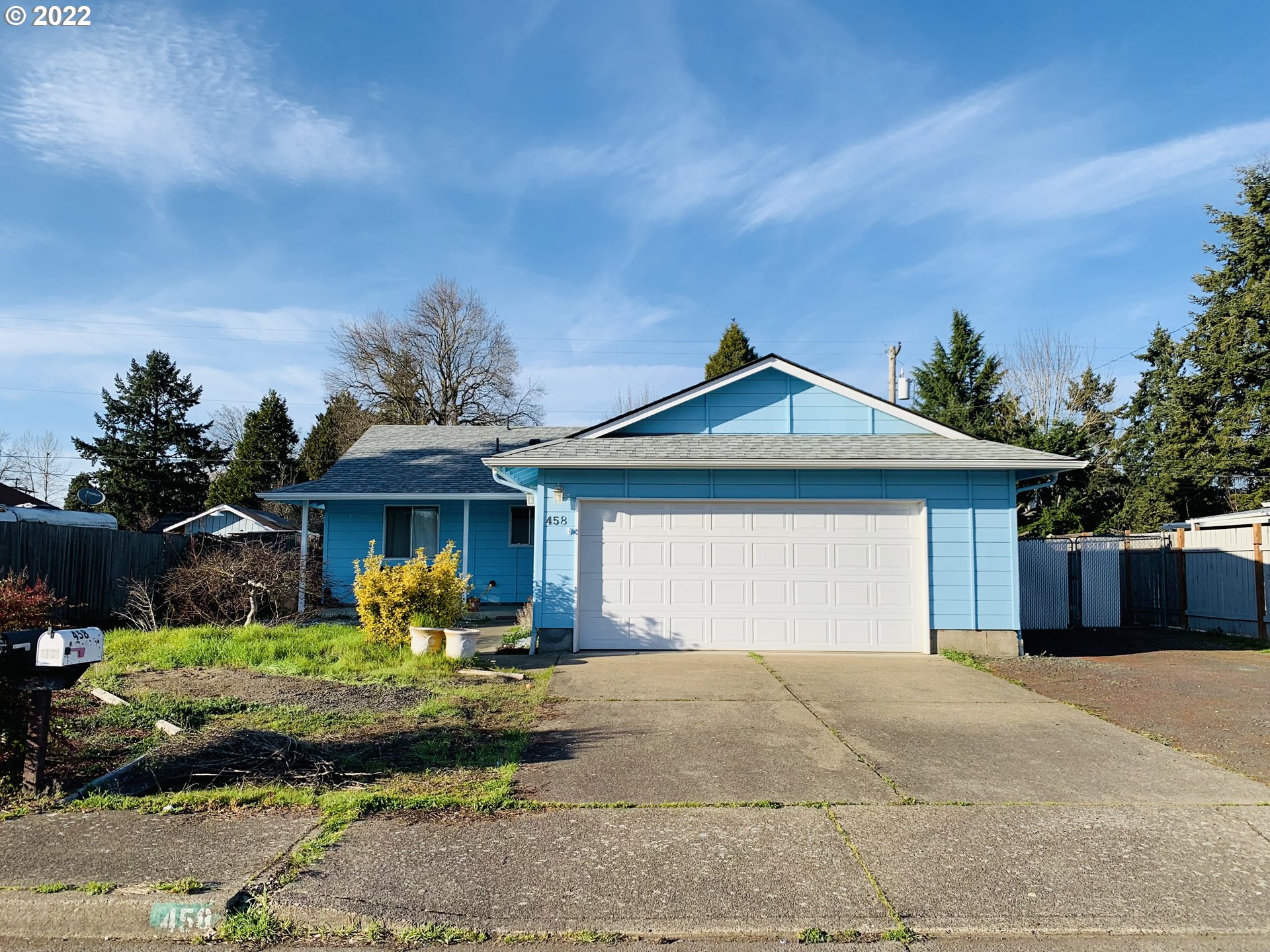 458 West Olympic Street Springfield, OR 97477 - Photo 1 of 23 a front view of a house with garden