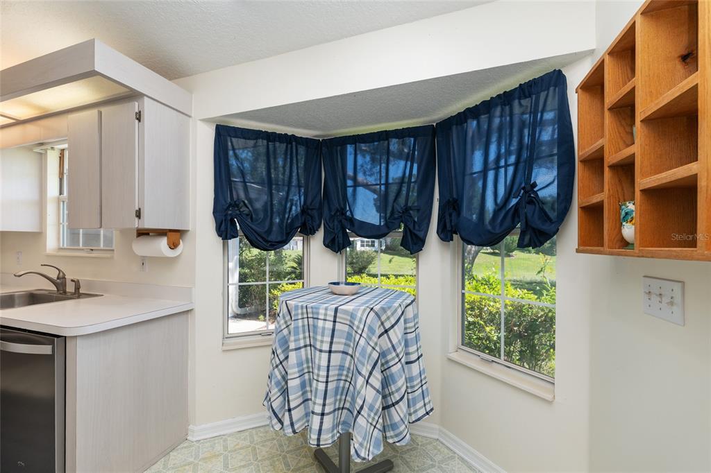 8038 Southwest 108th Loop Ocala, FL 34481 - Photo 17 of 48 a kitchen with furniture window and chairs