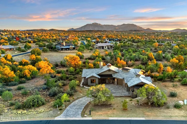 an aerial view of a house with a lake view