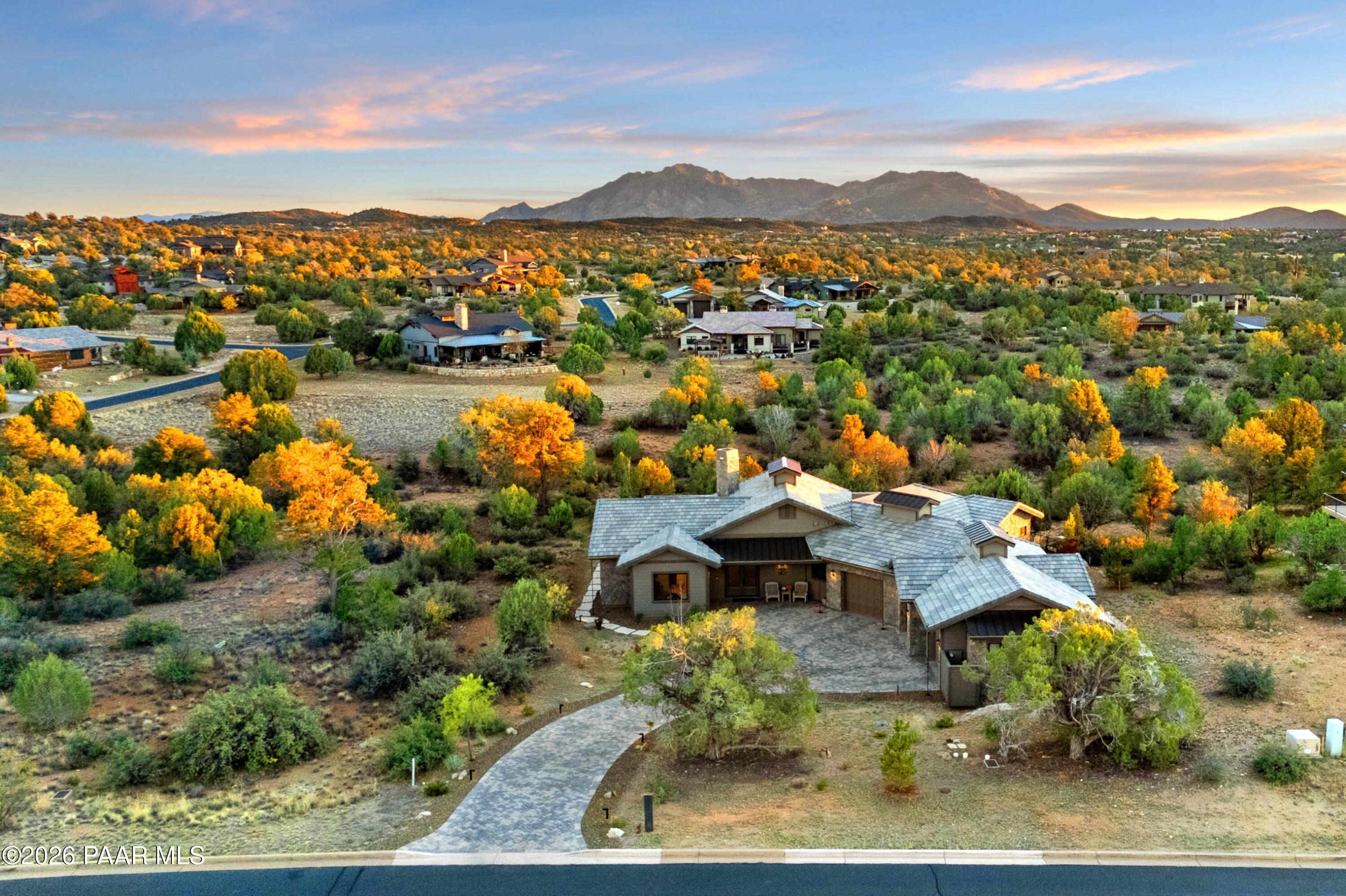 an aerial view of a house with a lake view