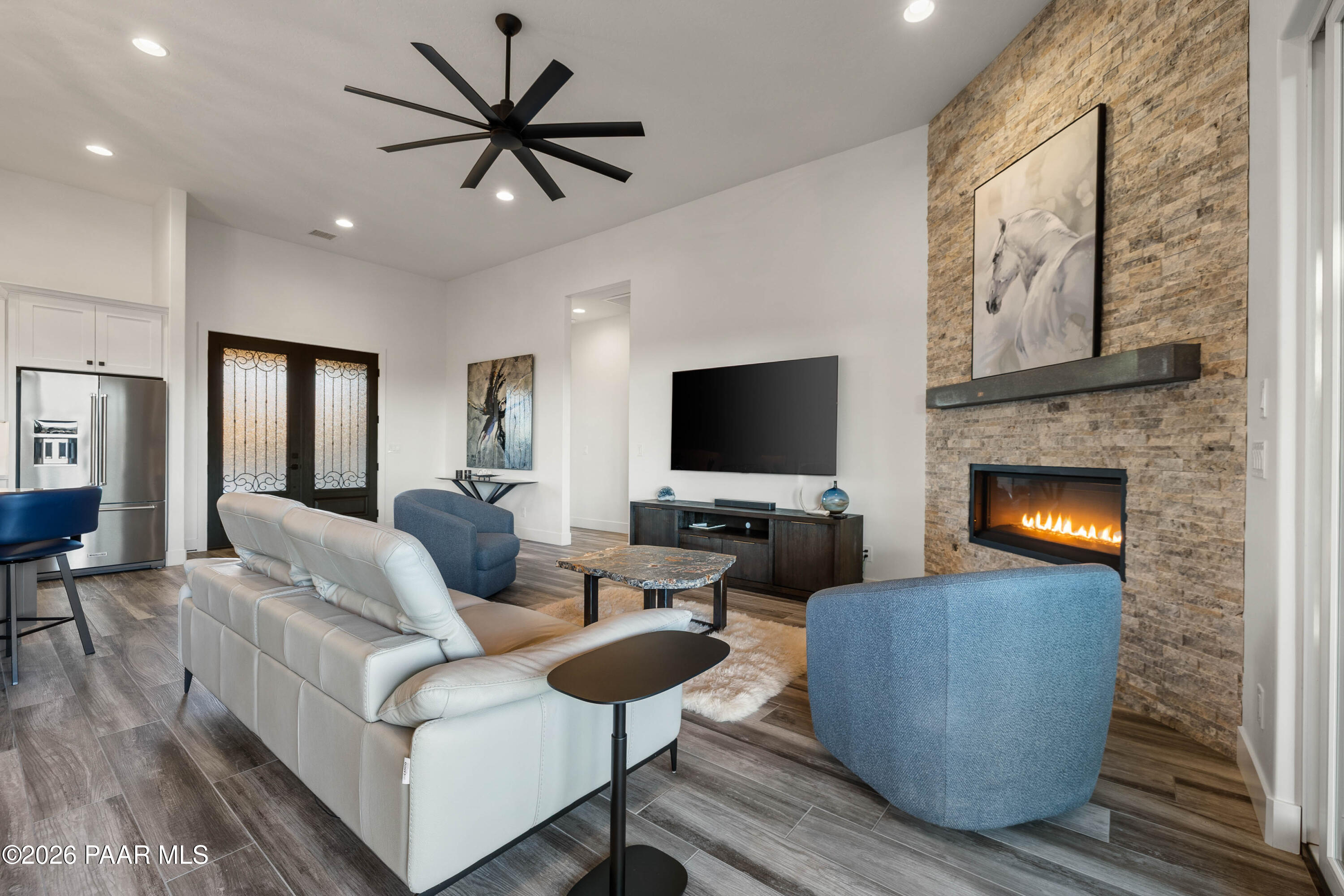 5475 West Three Forks Road Prescott, AZ 86305 - Photo 15 of 65 a living room with furniture and a flat screen tv