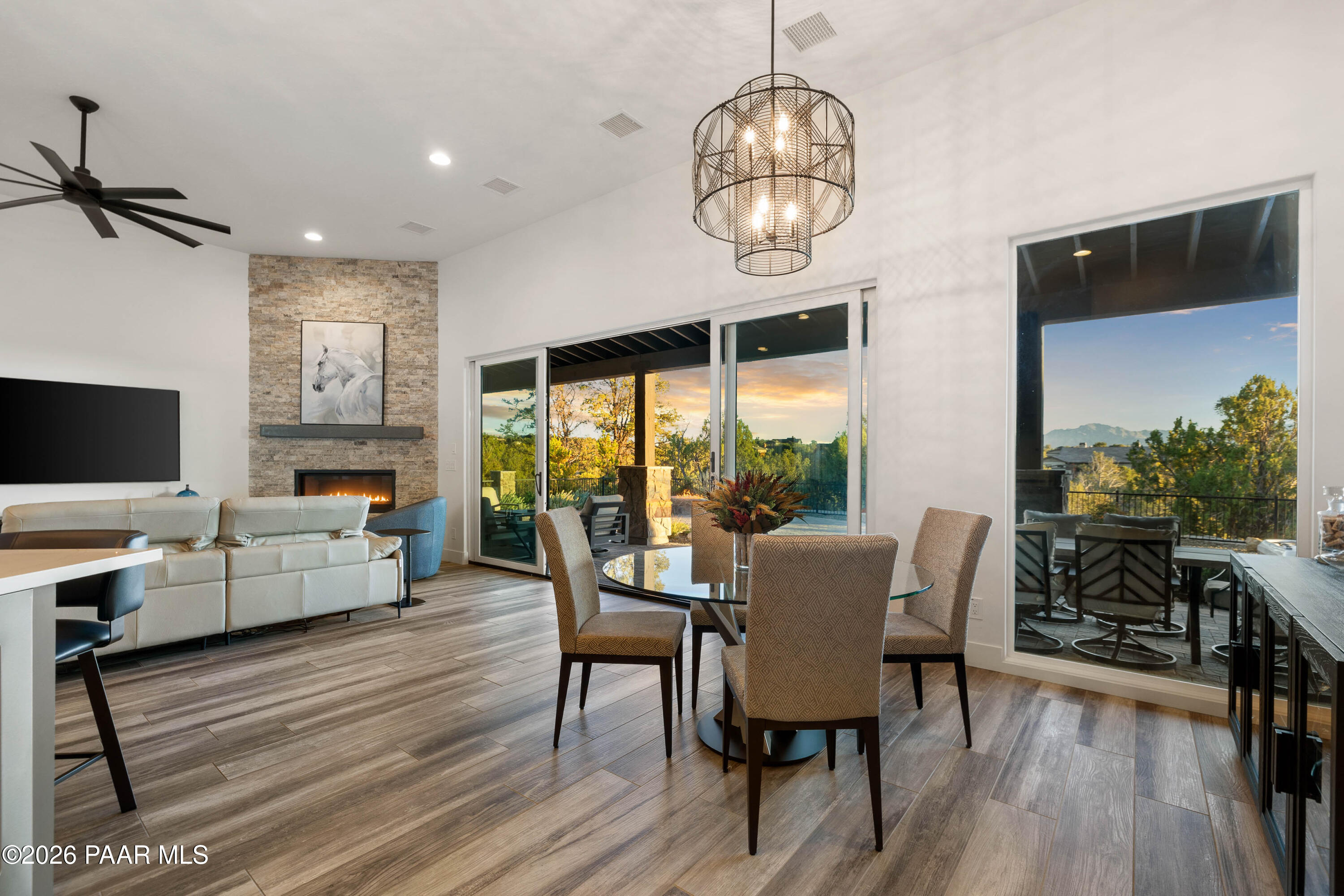 5475 West Three Forks Road Prescott, AZ 86305 - Photo 22 of 65 a dining room with furniture a chandelier and wooden floor