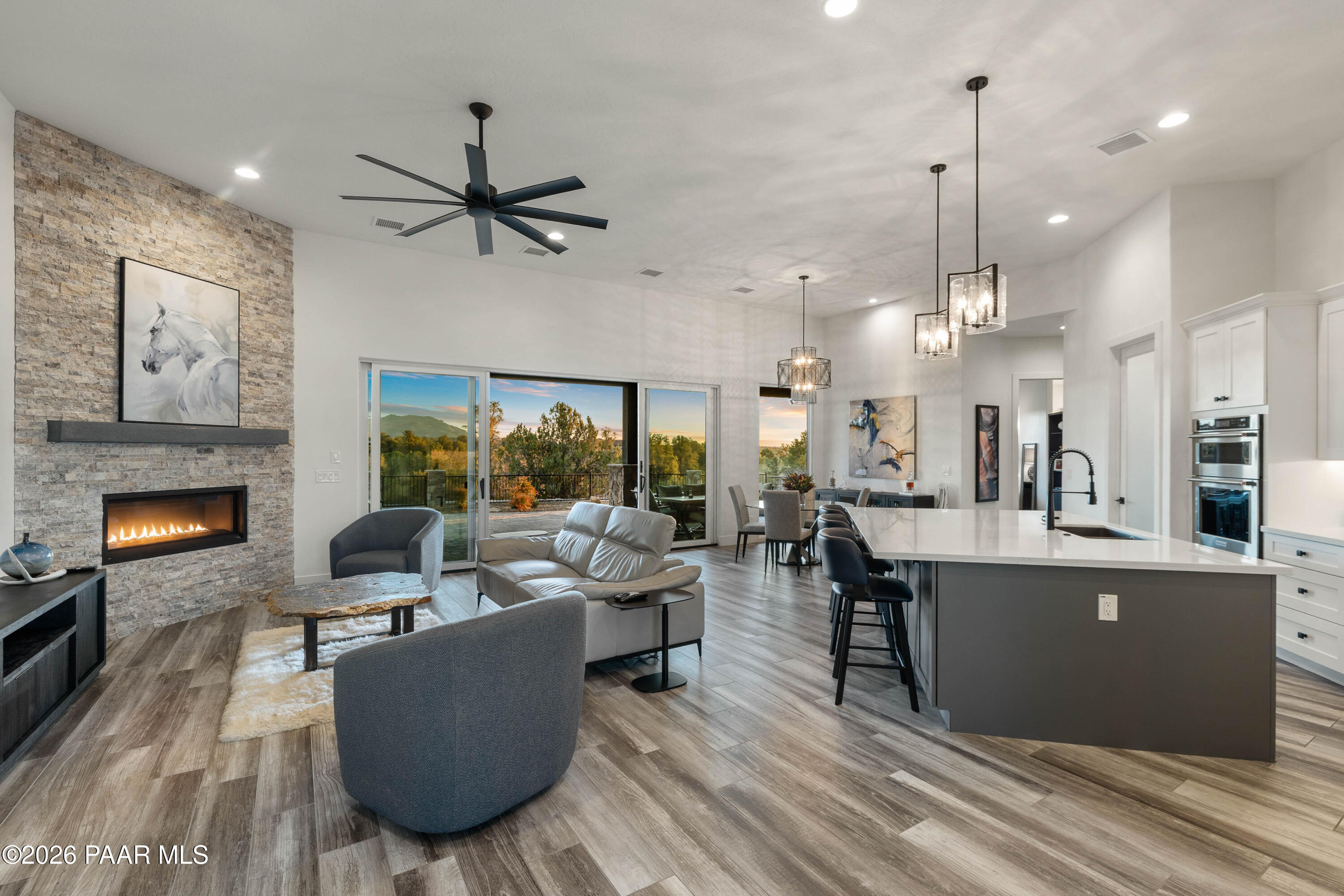 5475 West Three Forks Road Prescott, AZ 86305 - Photo 29 of 65 a living room with furniture and a fireplace