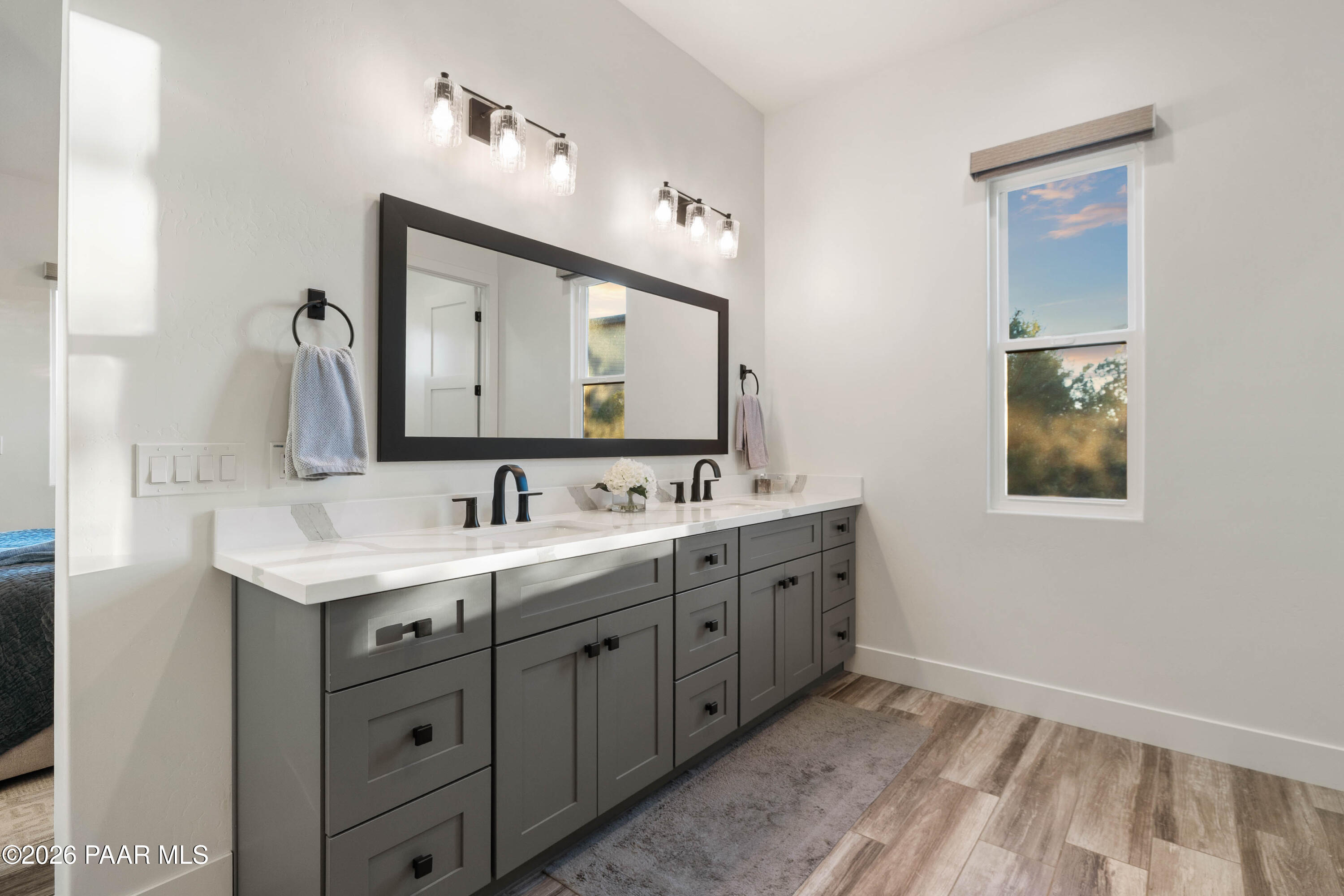 5475 West Three Forks Road Prescott, AZ 86305 - Photo 34 of 65 a bathroom with a double vanity sink and mirror