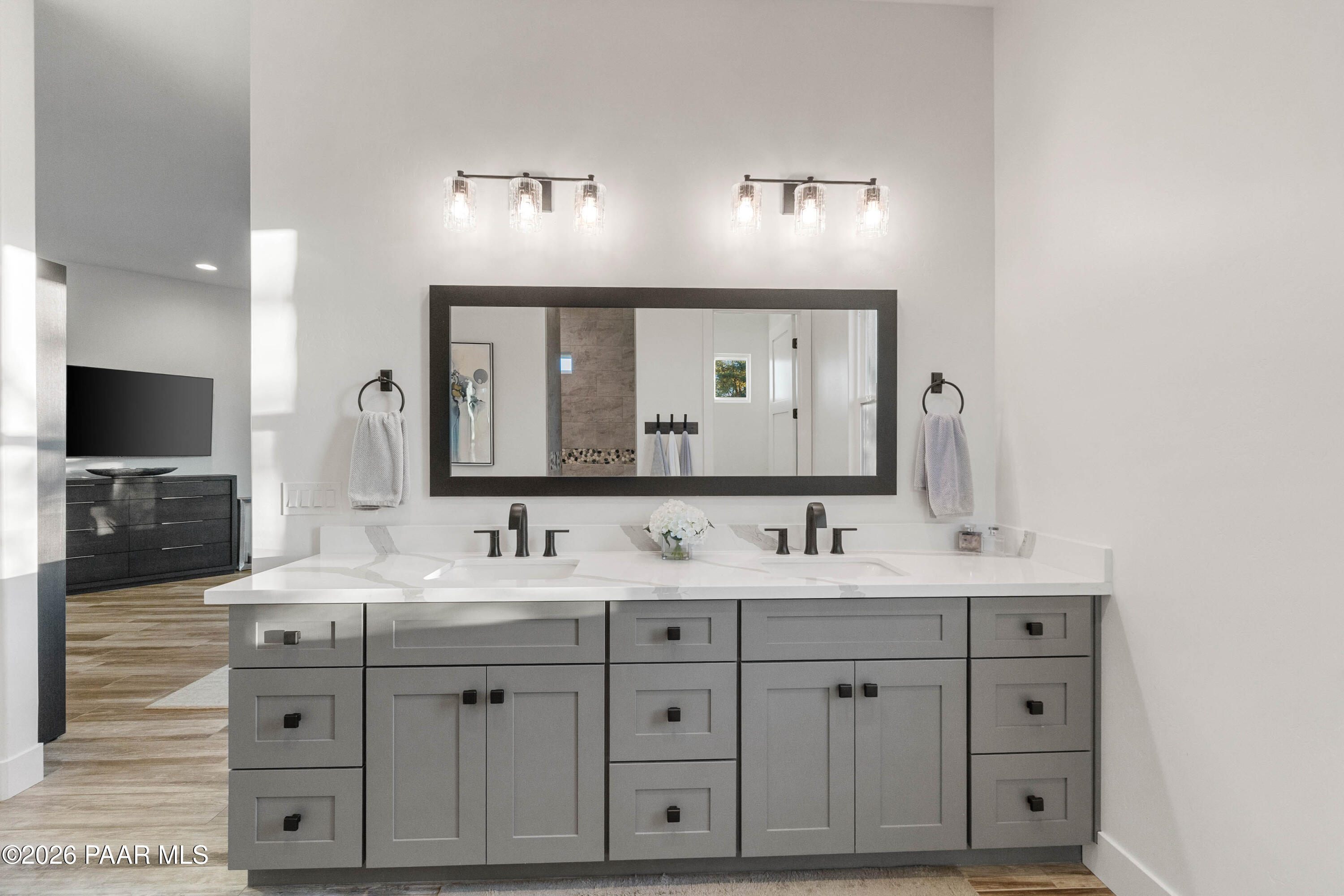 5475 West Three Forks Road Prescott, AZ 86305 - Photo 37 of 65 a bathroom with a double vanity sink and mirror