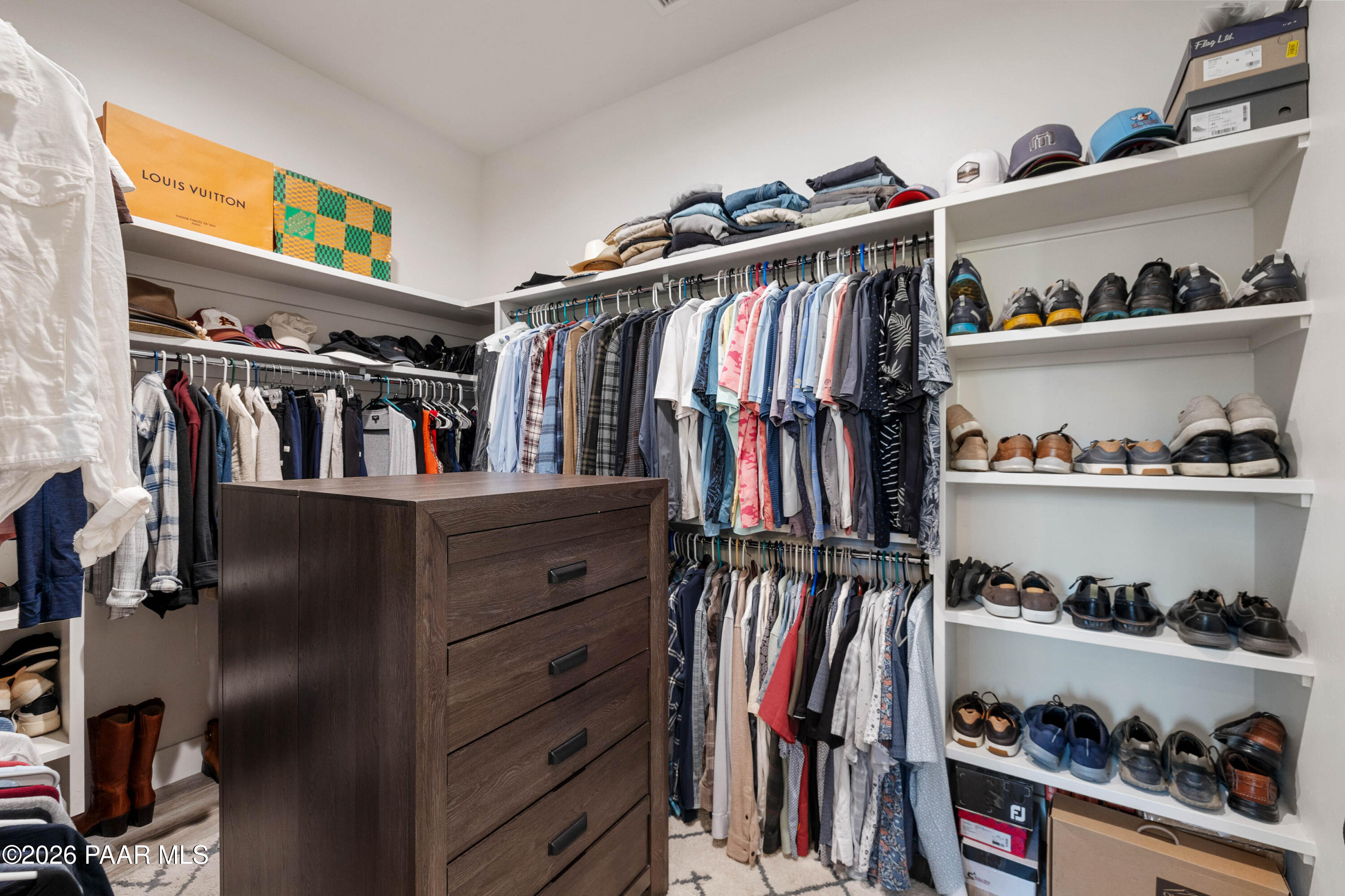 5475 West Three Forks Road Prescott, AZ 86305 - Photo 38 of 65 a view of walk in closet with clothes and shoes