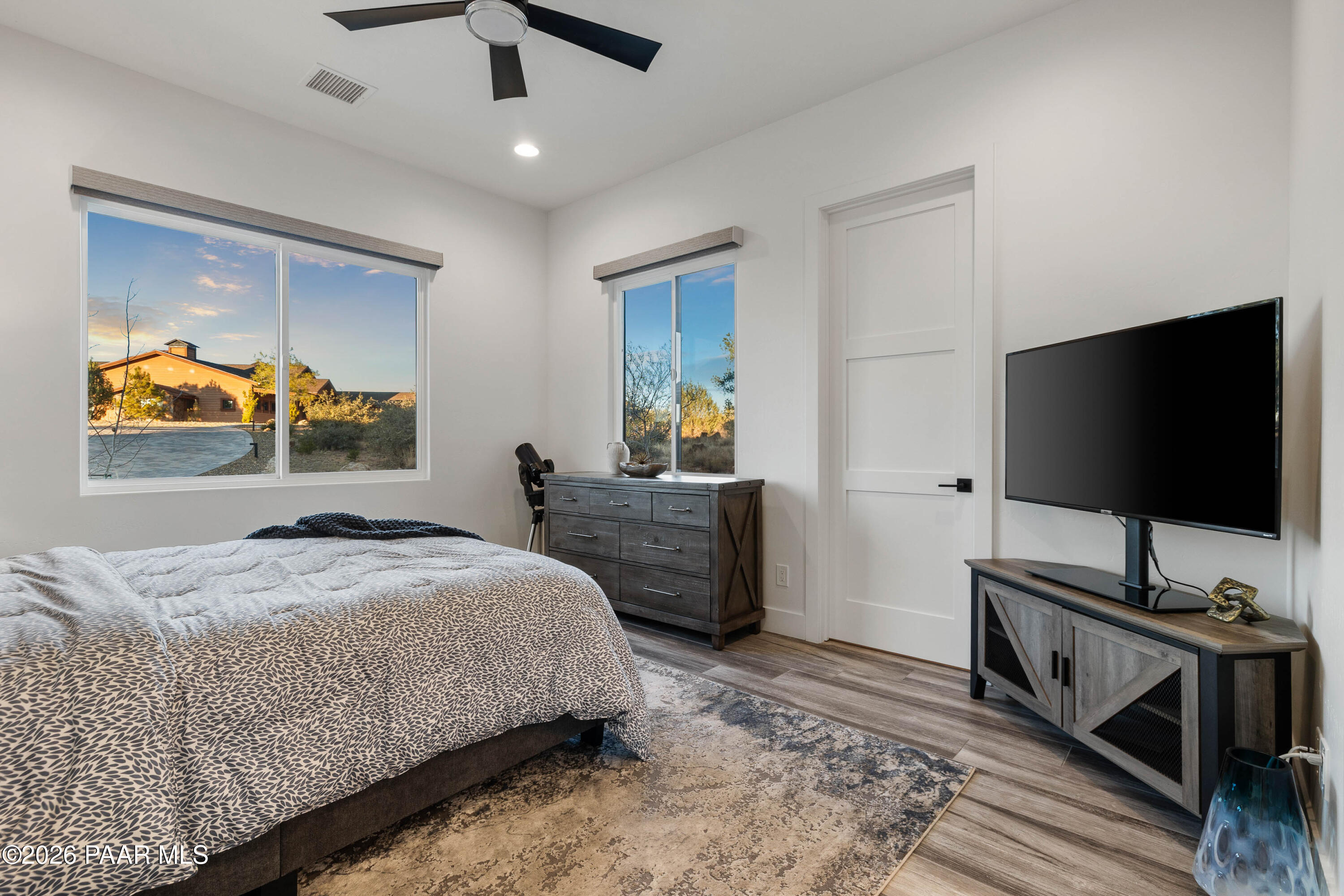 5475 West Three Forks Road Prescott, AZ 86305 - Photo 40 of 65 a bedroom with a bed and a flat screen tv