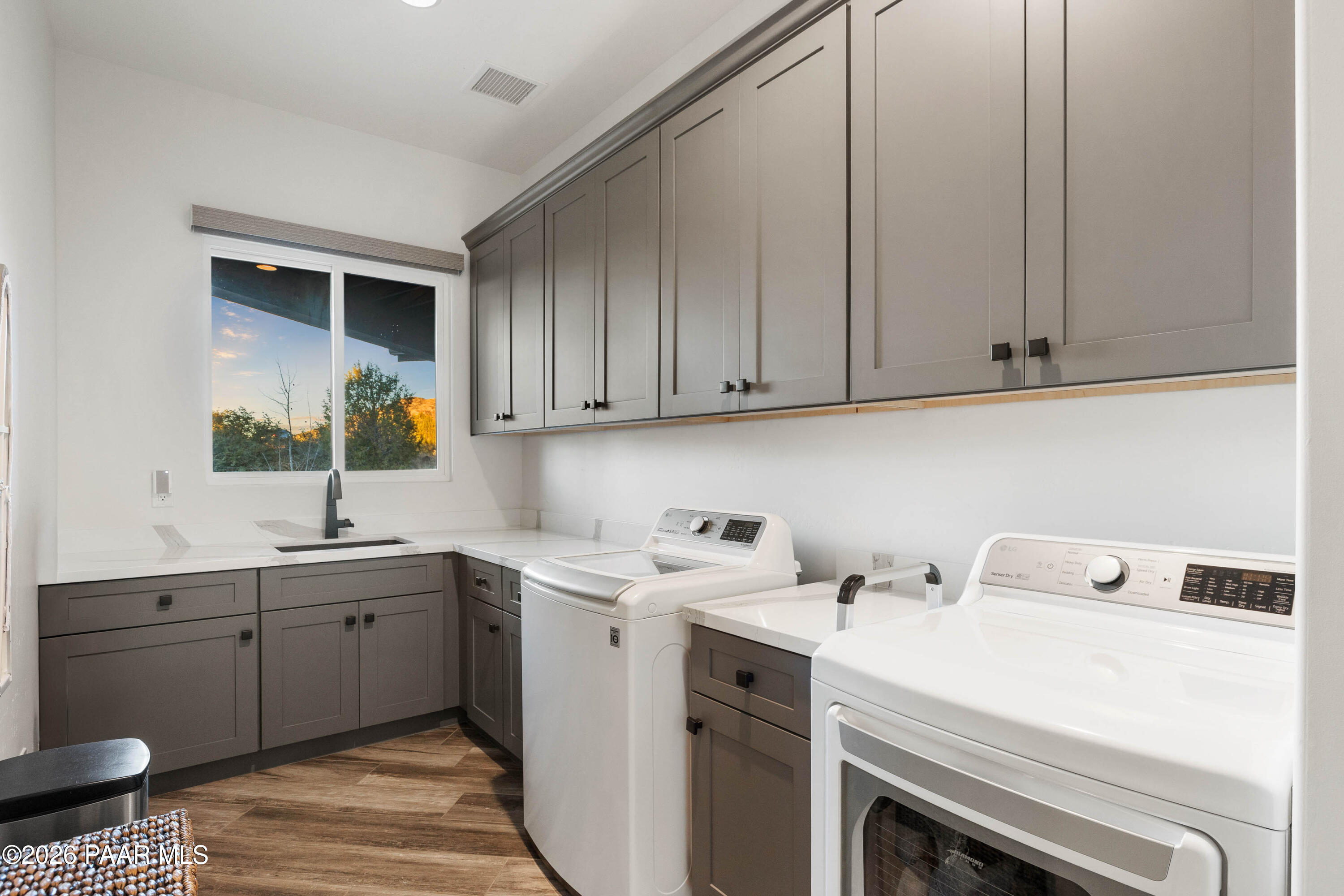 5475 West Three Forks Road Prescott, AZ 86305 - Photo 48 of 65 a view of cabinets a sink and a stove in a room