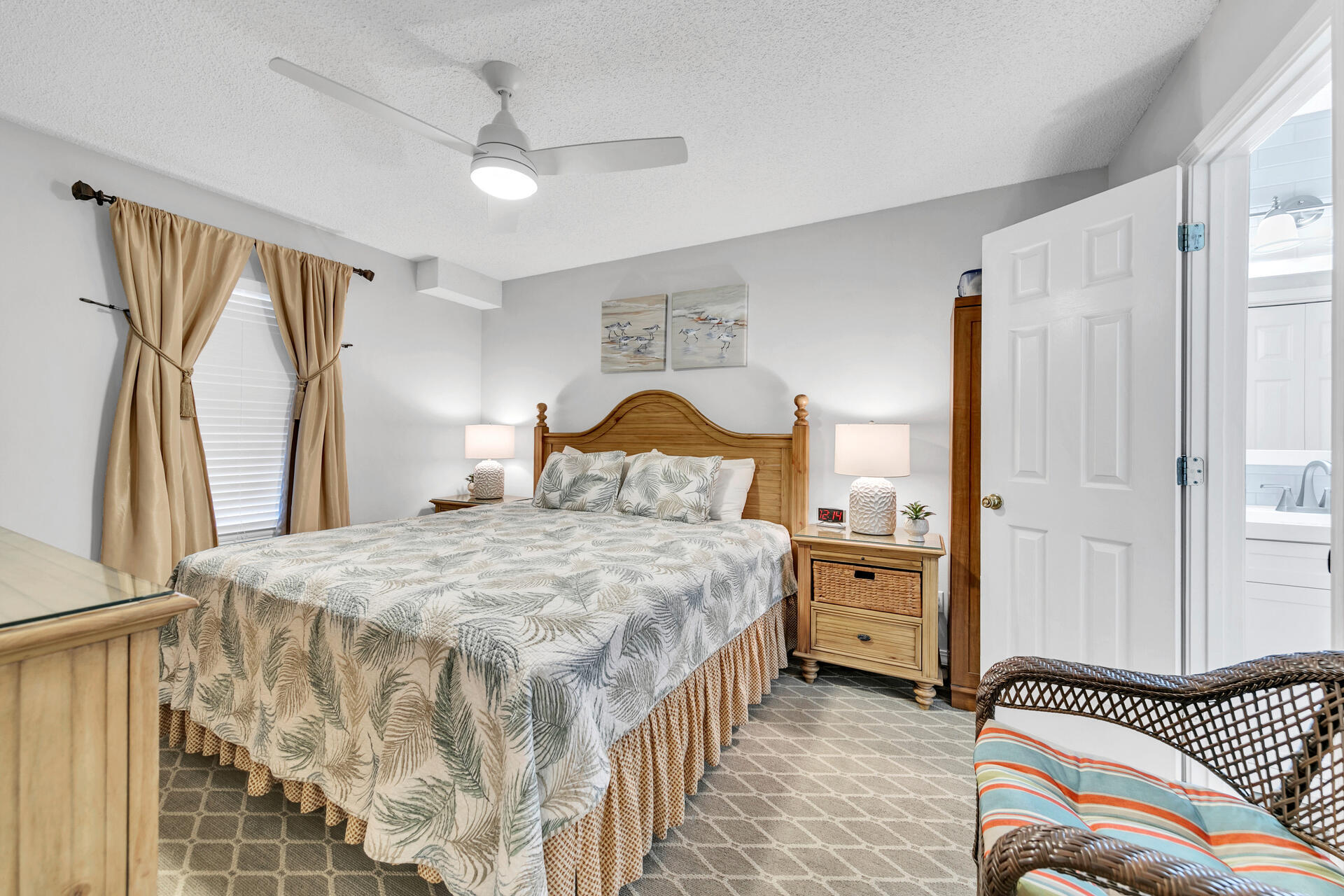 2606 Scenic Gulf Drive, Unit 4107 Miramar Beach, FL 32550 - Photo 11 of 55 a bedroom with a bed and a chandelier