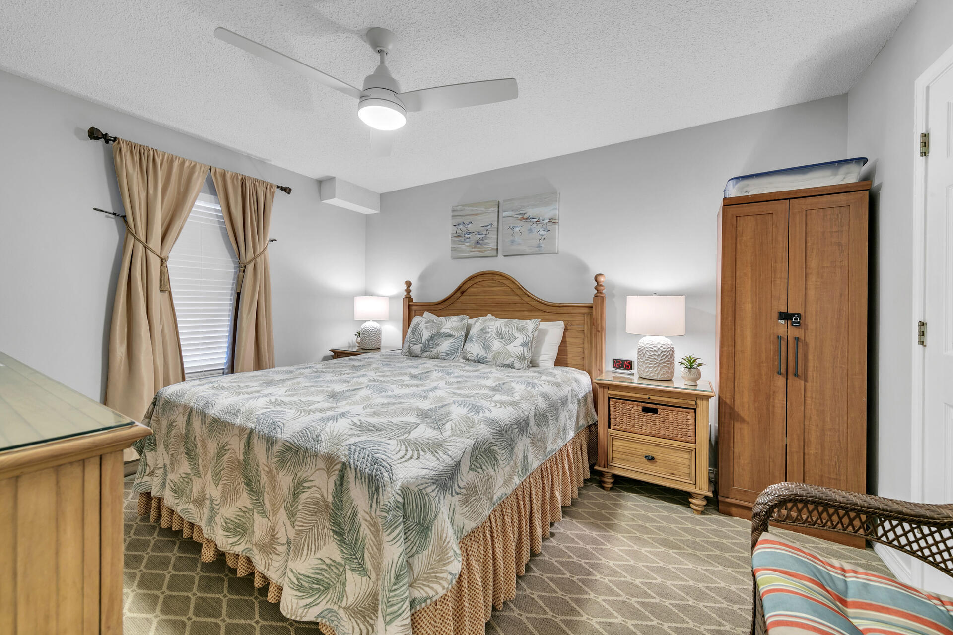 2606 Scenic Gulf Drive, Unit 4107 Miramar Beach, FL 32550 - Photo 12 of 55 a bedroom with a bed and a chandelier