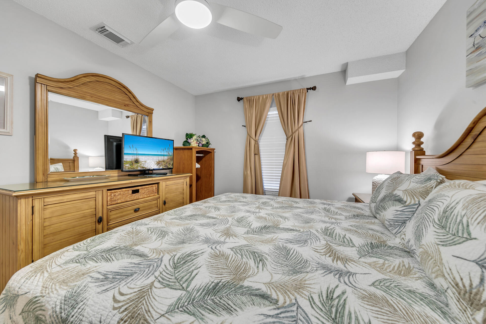 2606 Scenic Gulf Drive, Unit 4107 Miramar Beach, FL 32550 - Photo 13 of 55 a bedroom with a large bed and a large mirror