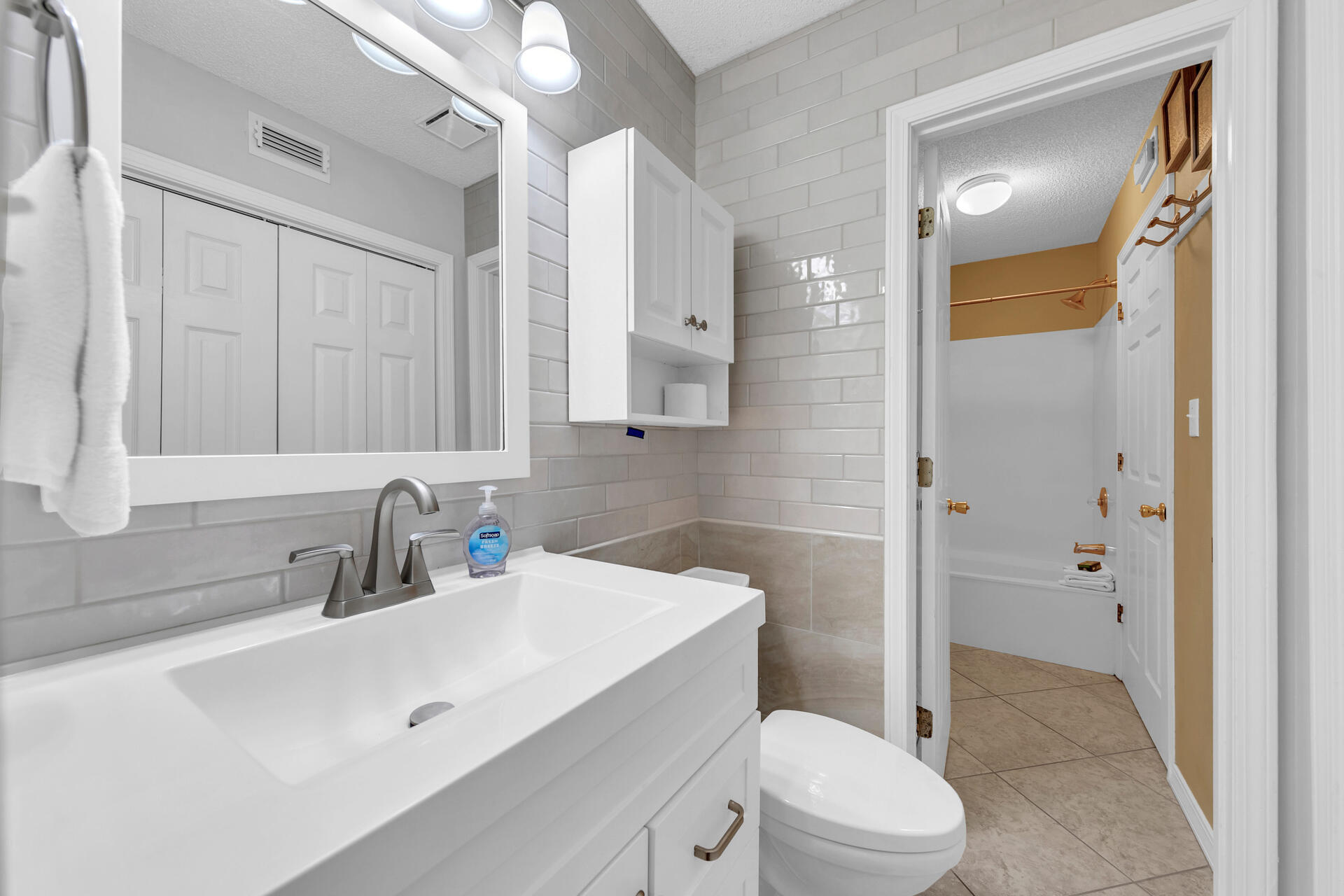 2606 Scenic Gulf Drive, Unit 4107 Miramar Beach, FL 32550 - Photo 14 of 55 a bathroom with a sink a toilet a mirror and shower