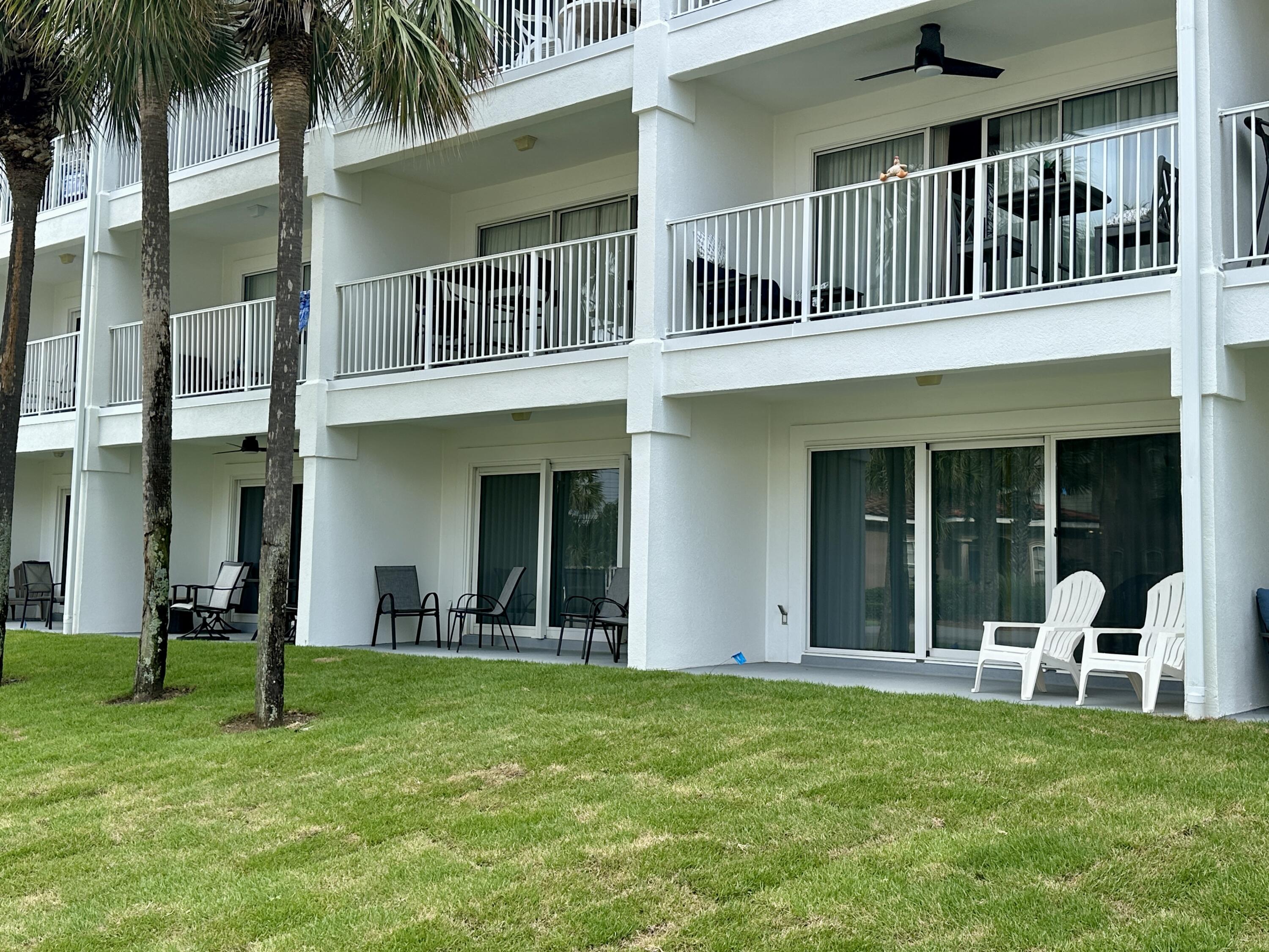 2606 Scenic Gulf Drive, Unit 4107 Miramar Beach, FL 32550 - Photo 20 of 55 a view of a house with a yard and plants