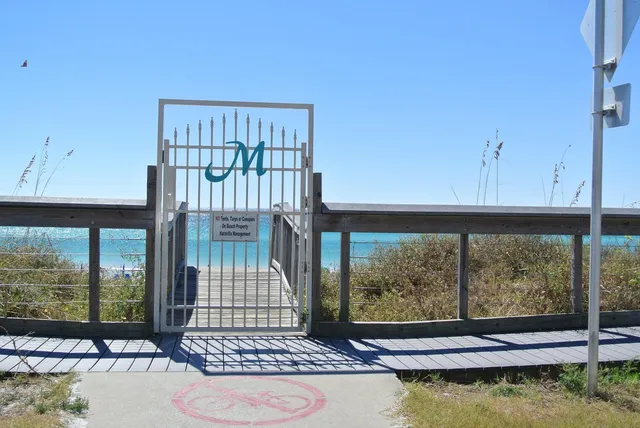a view of balcony with wooden floor