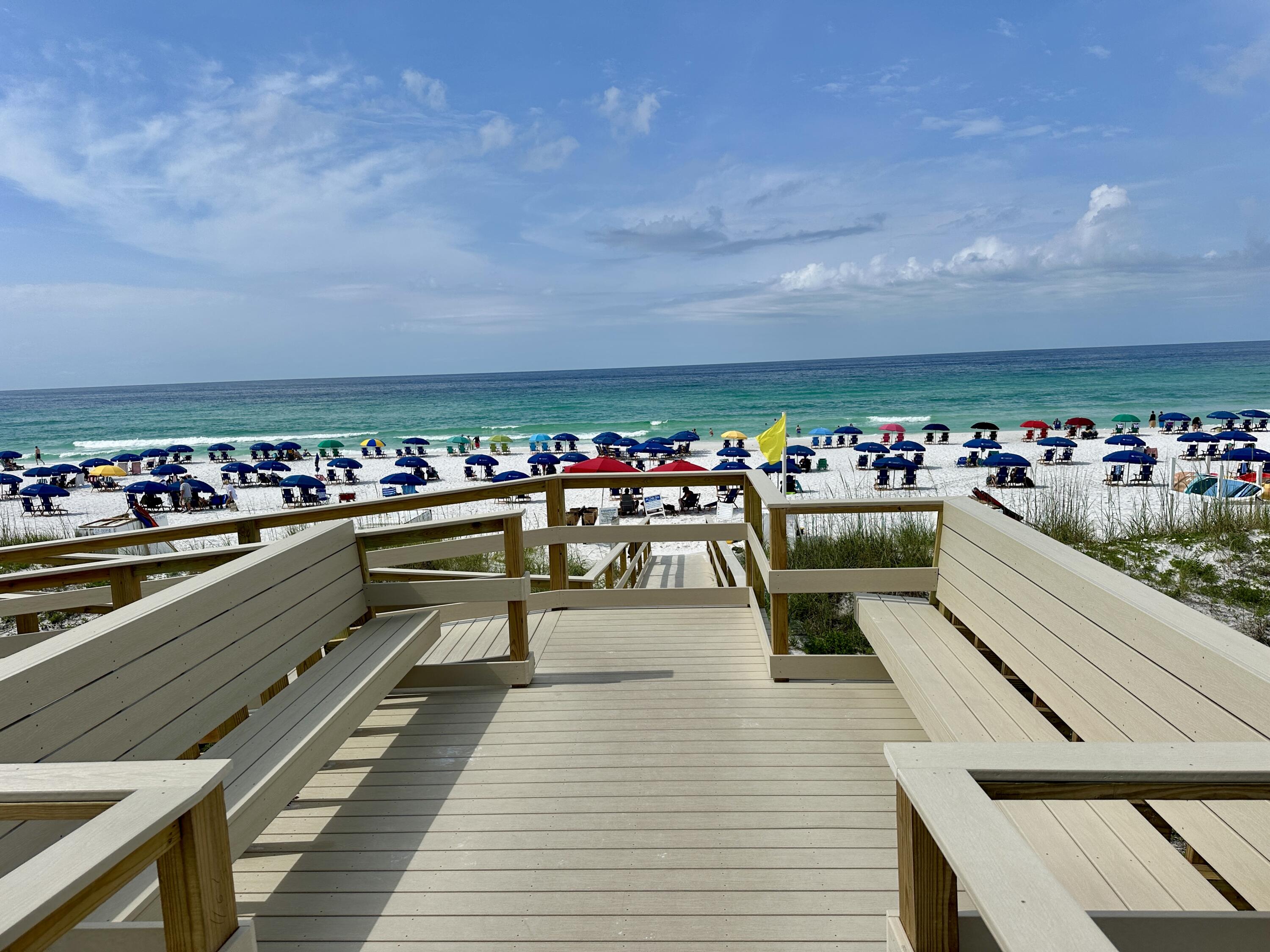 2606 Scenic Gulf Drive, Unit 4107 Miramar Beach, FL 32550 - Photo 26 of 55 a view of a balcony with dining table and chairs