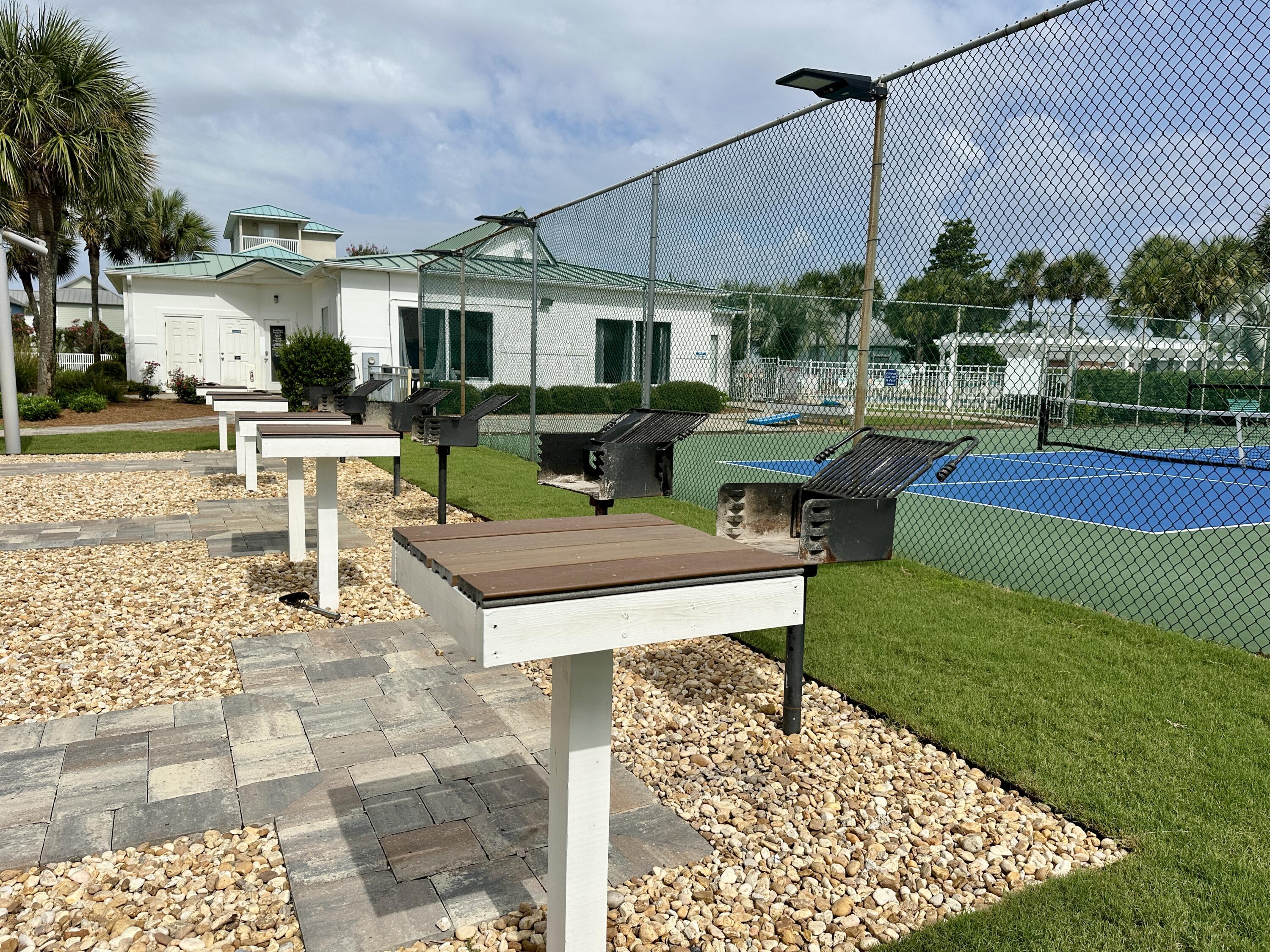 2606 Scenic Gulf Drive, Unit 4107 Miramar Beach, FL 32550 - Photo 31 of 55 a view of a house with backyard sitting area and garden