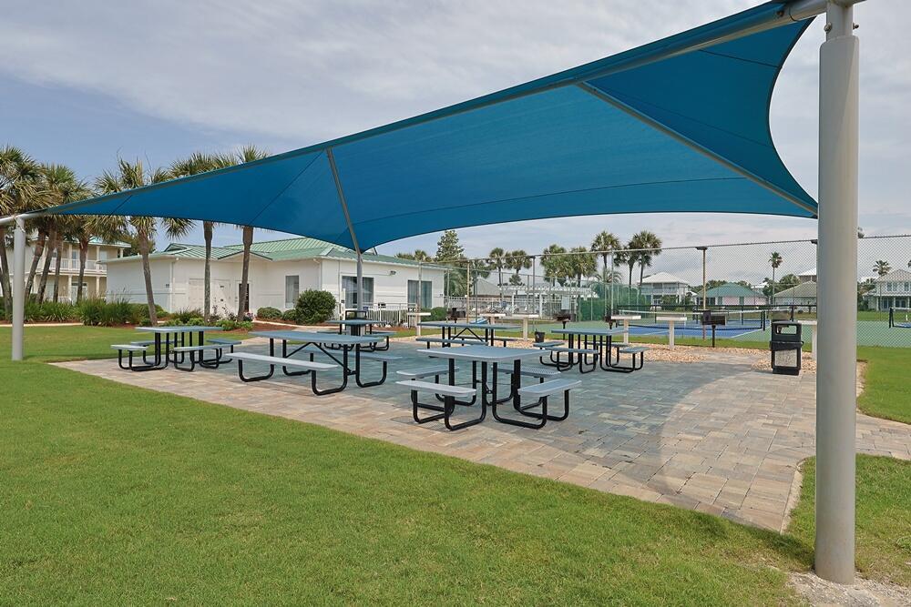 2606 Scenic Gulf Drive, Unit 4107 Miramar Beach, FL 32550 - Photo 37 of 55 a view of a swimming pool with lawn chairs and couches