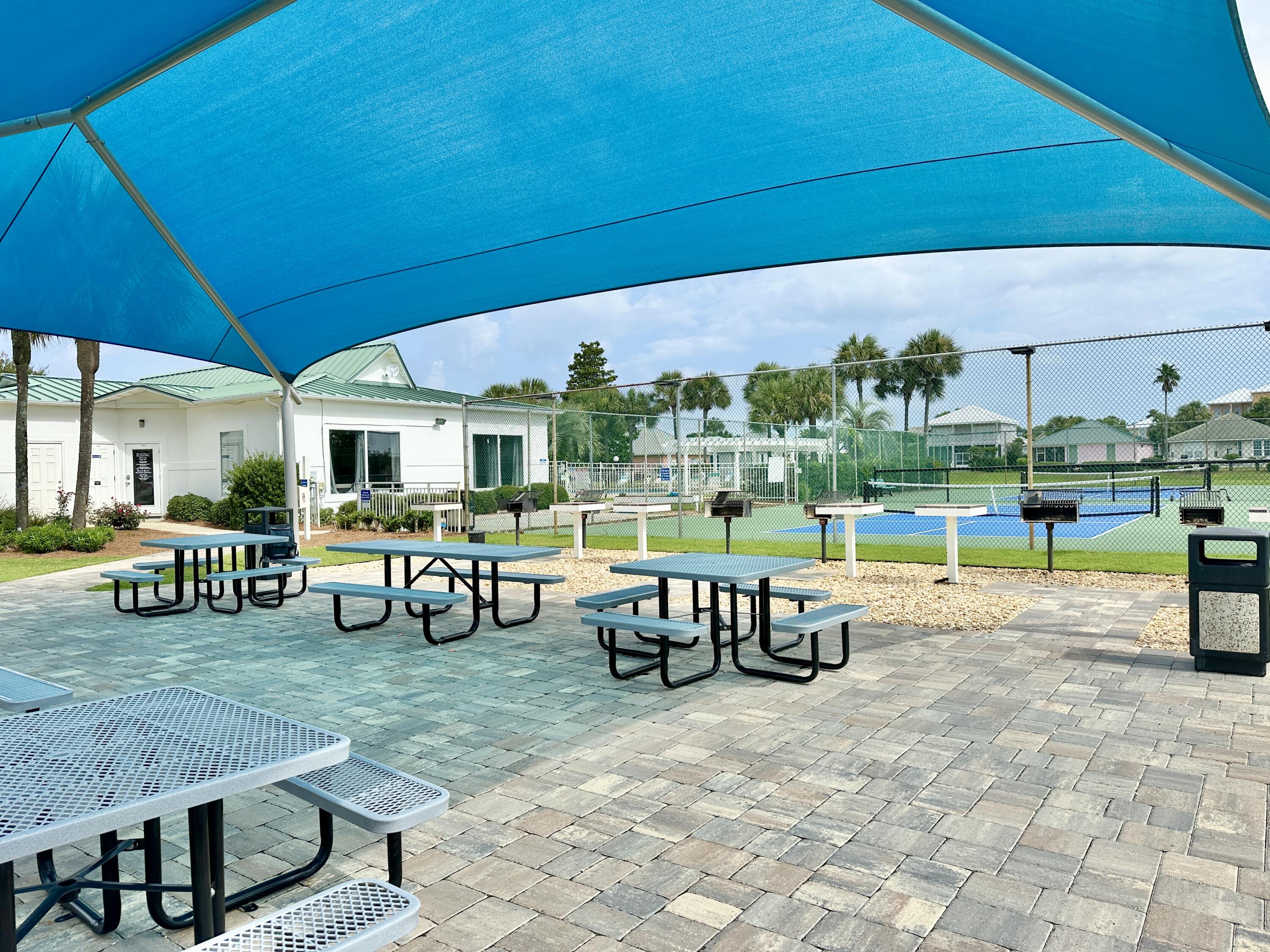 2606 Scenic Gulf Drive, Unit 4107 Miramar Beach, FL 32550 - Photo 38 of 55 a view of a backyard with swimming pool and sitting area