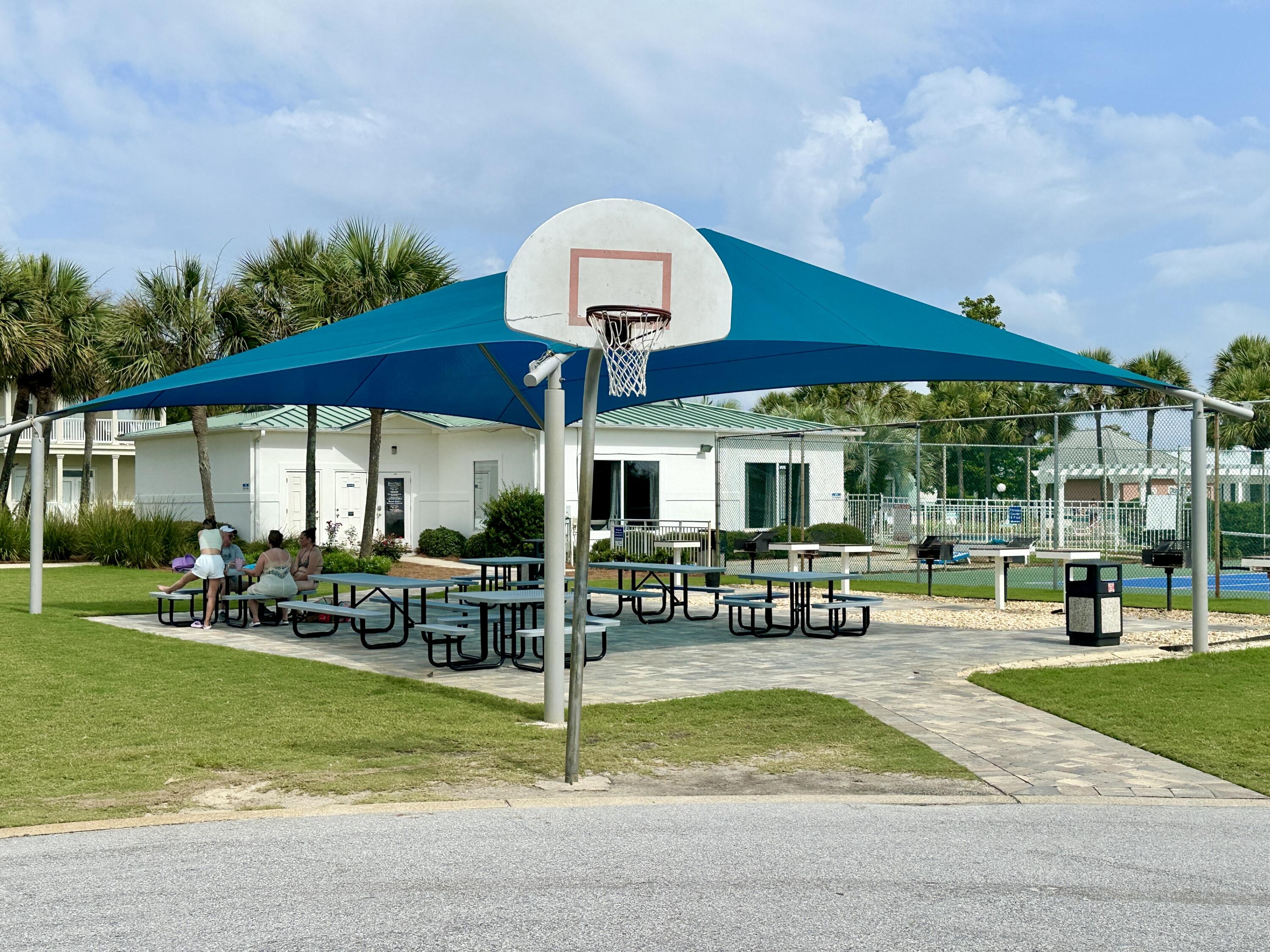 2606 Scenic Gulf Drive, Unit 4107 Miramar Beach, FL 32550 - Photo 39 of 55 a view of a house with a swimming pool and sitting area