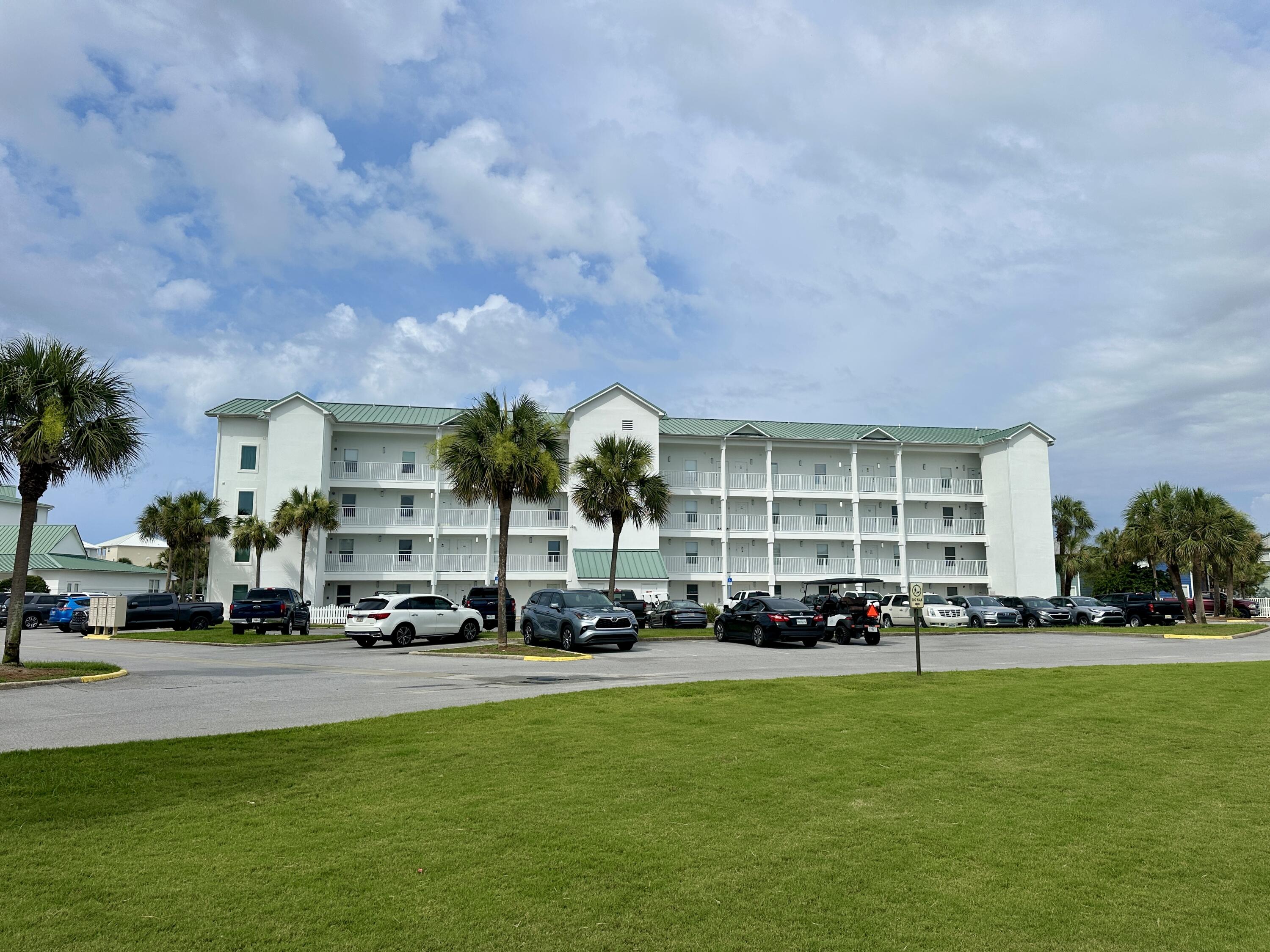2606 Scenic Gulf Drive, Unit 4107 Miramar Beach, FL 32550 - Photo 44 of 55 a cars parked in front of a building