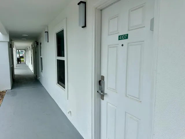 a view of a building with a yard