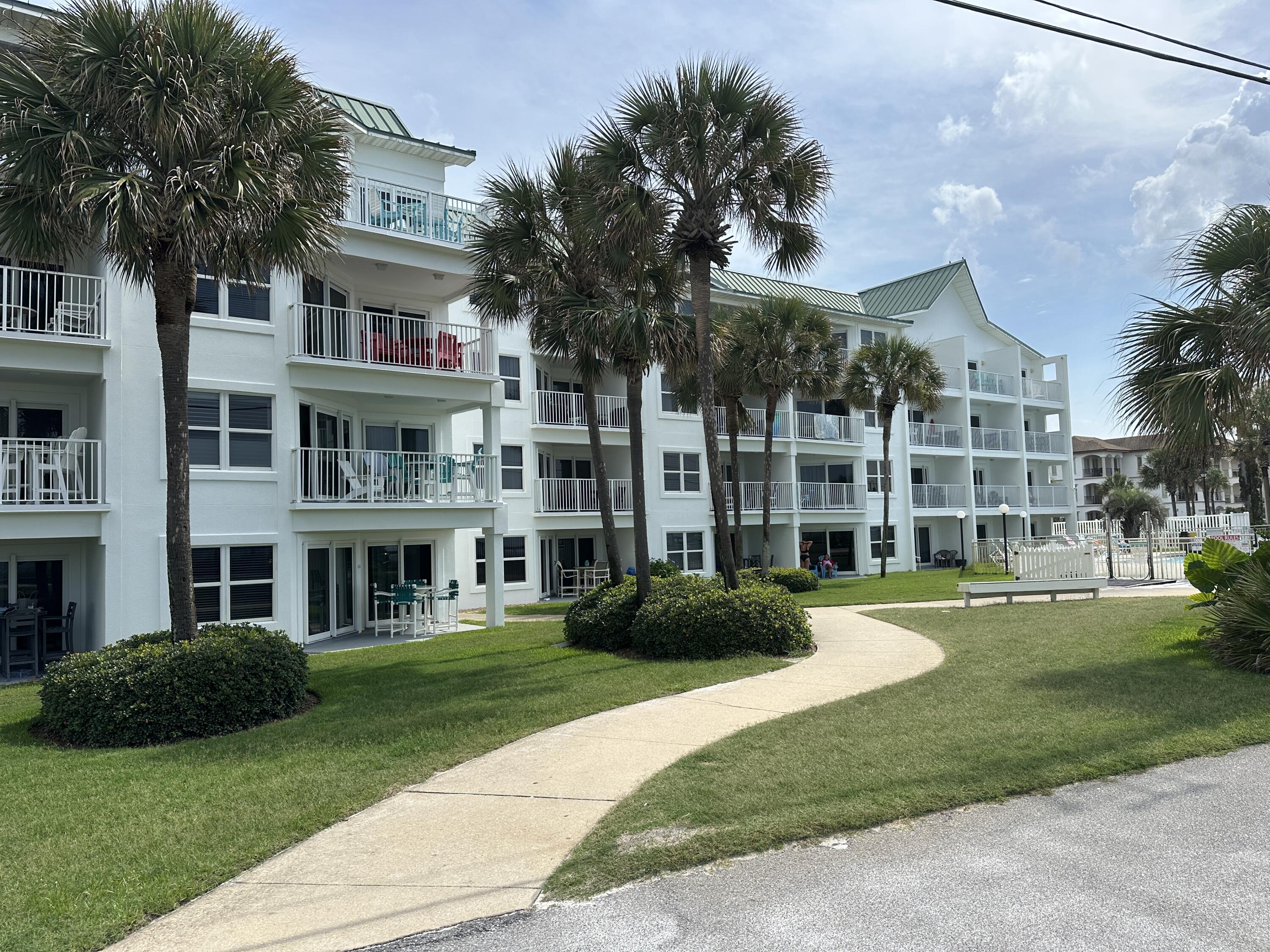 2606 Scenic Gulf Drive, Unit 4107 Miramar Beach, FL 32550 - Photo 50 of 55 a view of a building with a yard