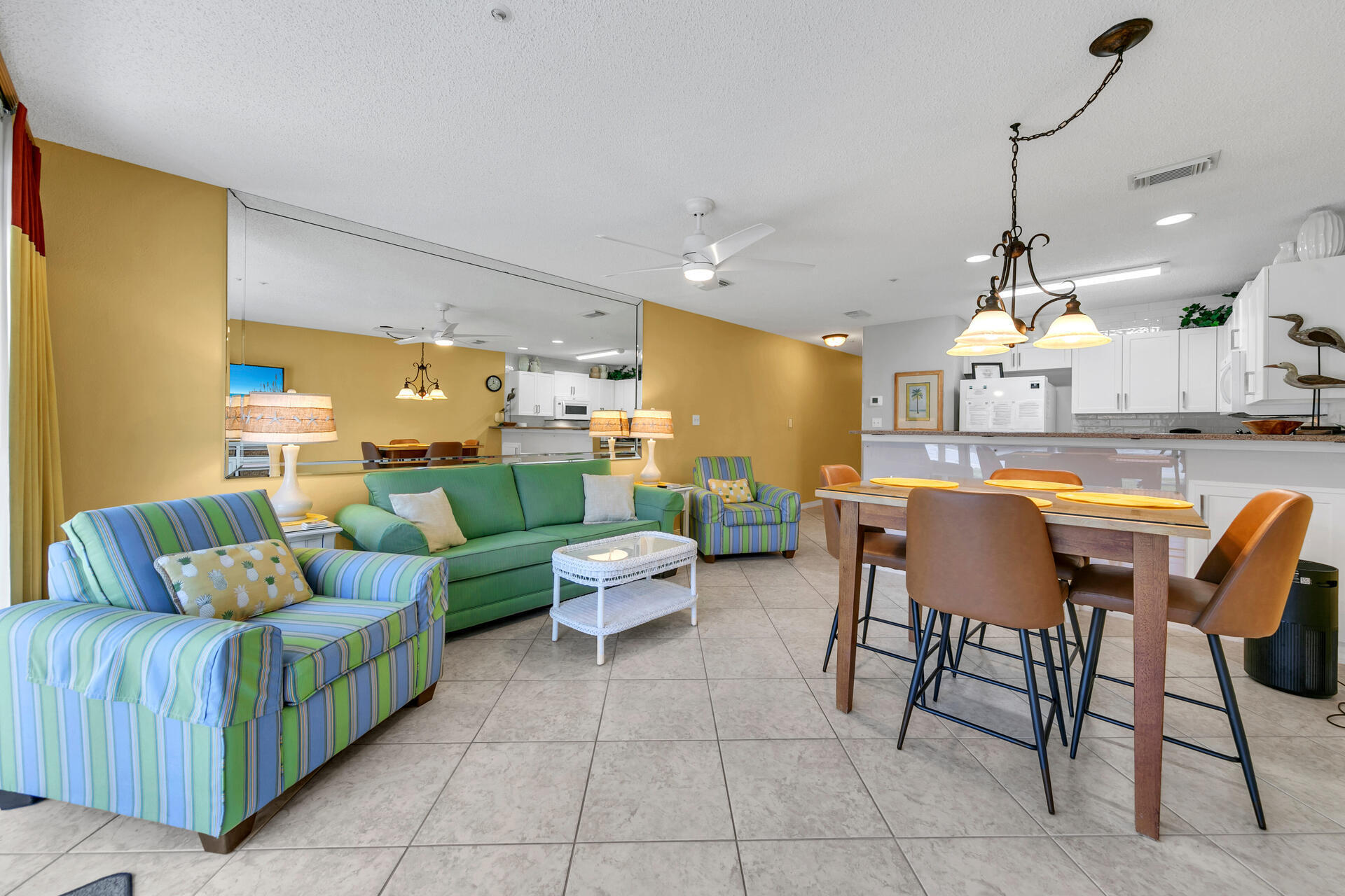 2606 Scenic Gulf Drive, Unit 4107 Miramar Beach, FL 32550 - Photo 5 of 55 a living room with lots of furniture and a chandelier