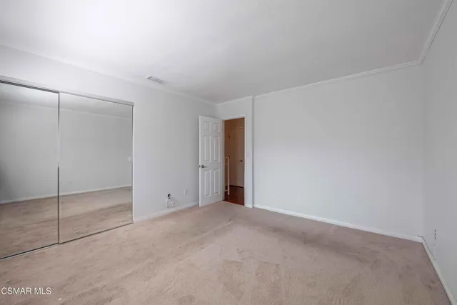 a view of a room with rack on the wall