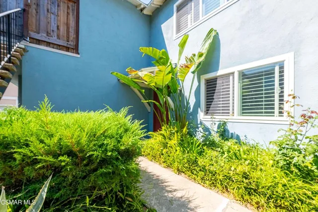 a view of backyard with tub and stairs
