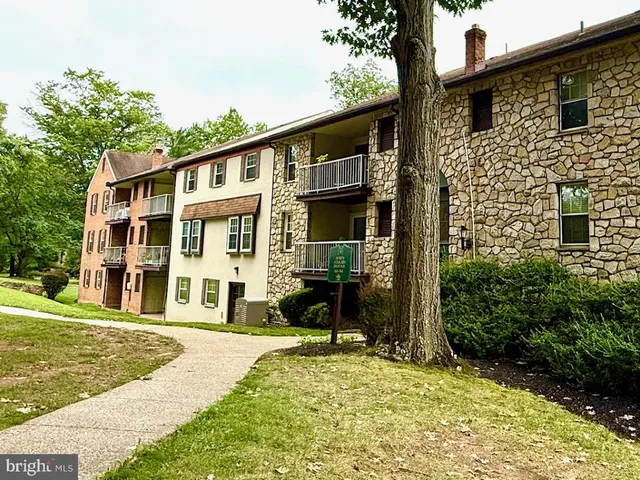 front view of a building with a yard