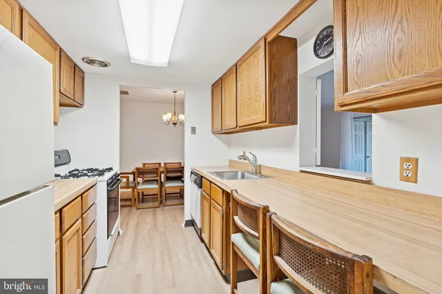 a spacious bathroom with a granite countertop sink and a mirror