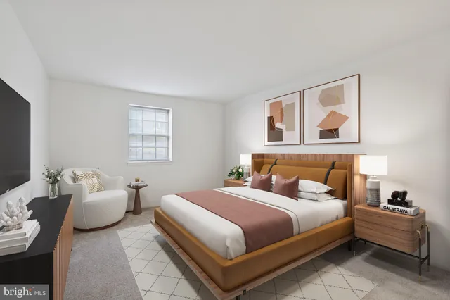 a bedroom with a bed and a couch