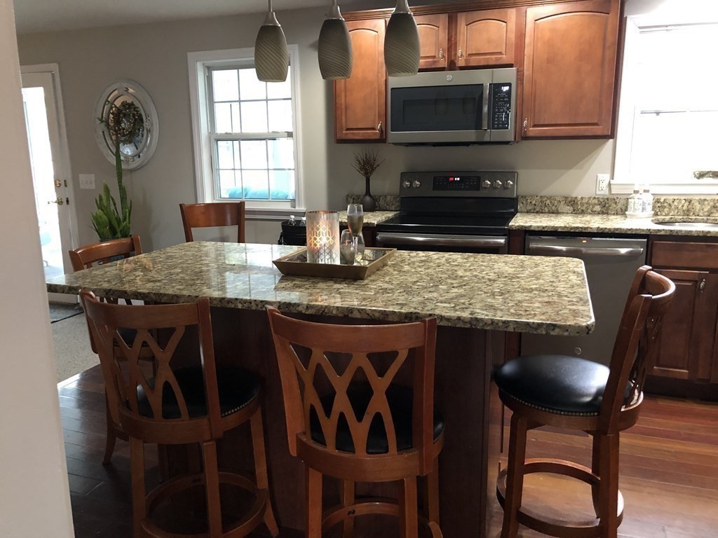 9 Blue Hill Road Worcester, MA 01606 - Photo 3 of 25 a table with chairs and window