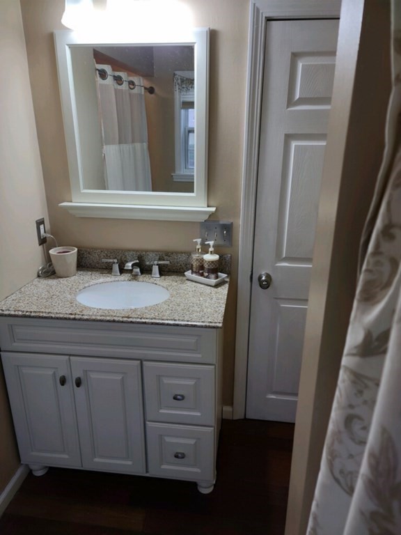 9 Blue Hill Road Worcester, MA 01606 - Photo 8 of 25 a bathroom with a sink and a mirror
