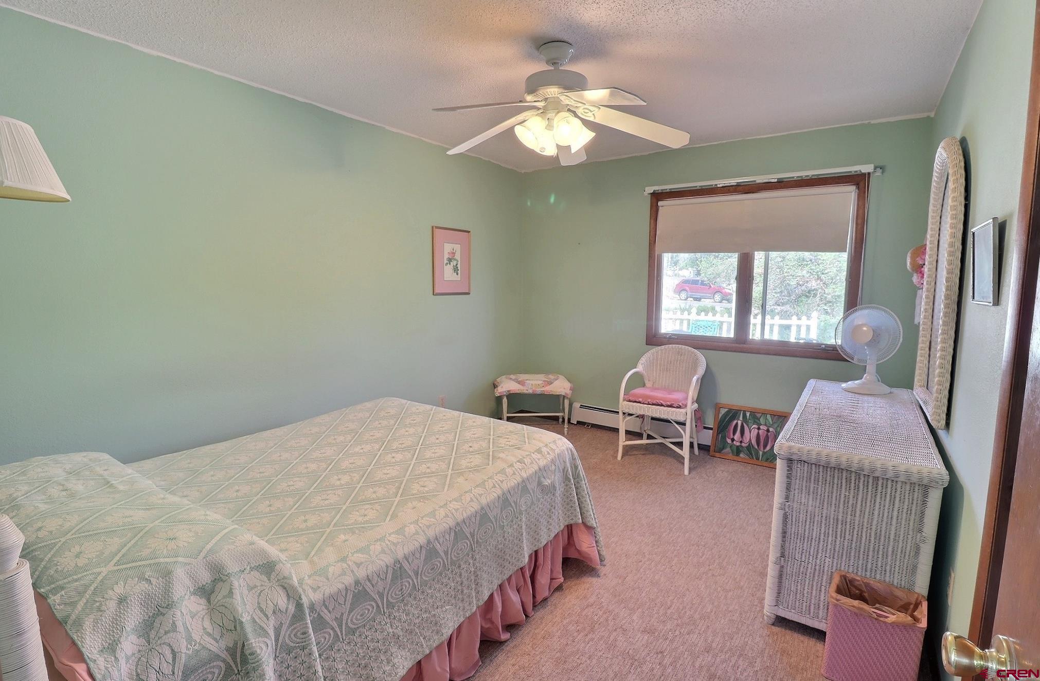 12303 West Spring Circle Eckert, CO 81418 - Photo 11 of 26 a bedroom with a bed and a chandelier