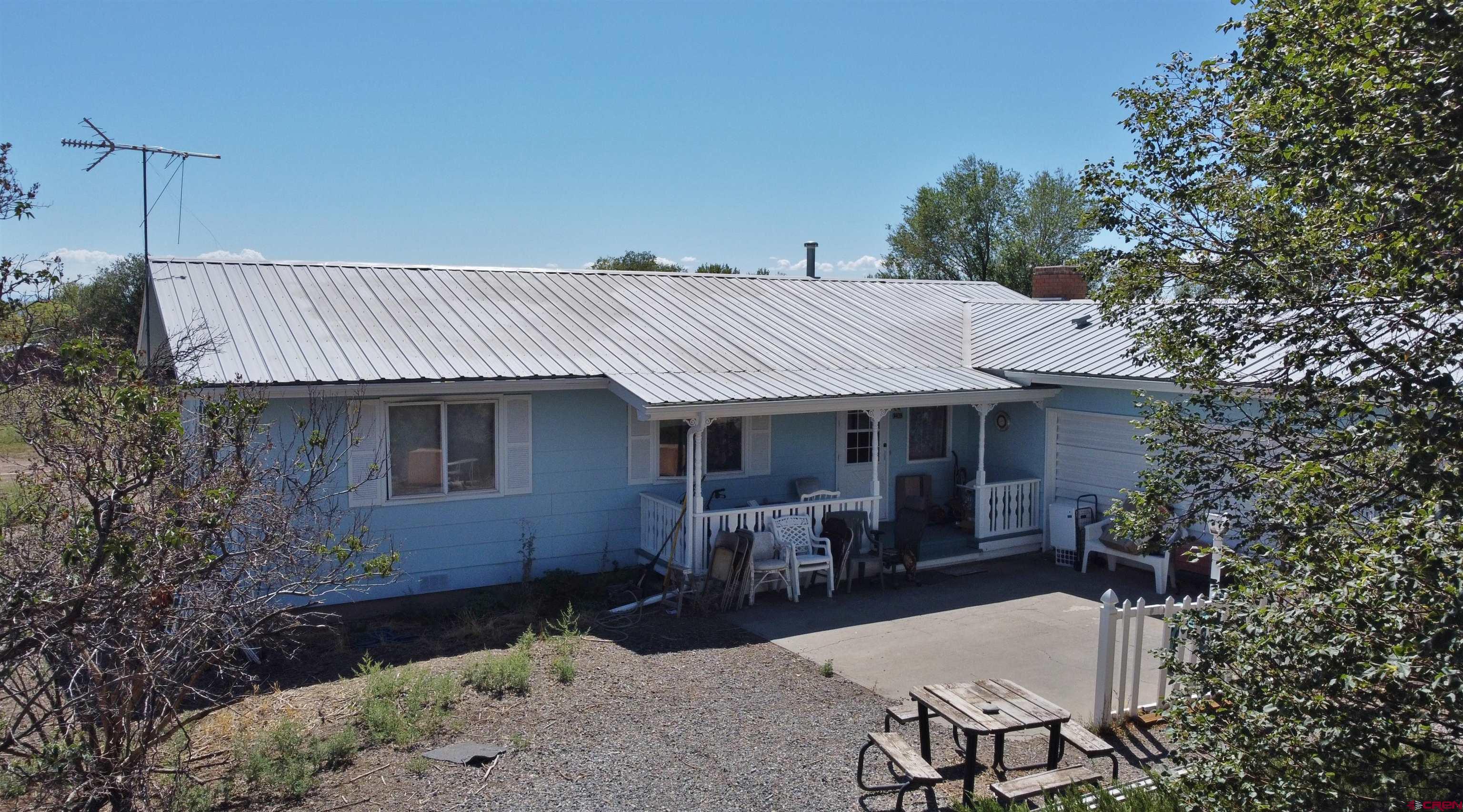 12303 West Spring Circle Eckert, CO 81418 - Photo 20 of 26 a view of a house with patio and backyard