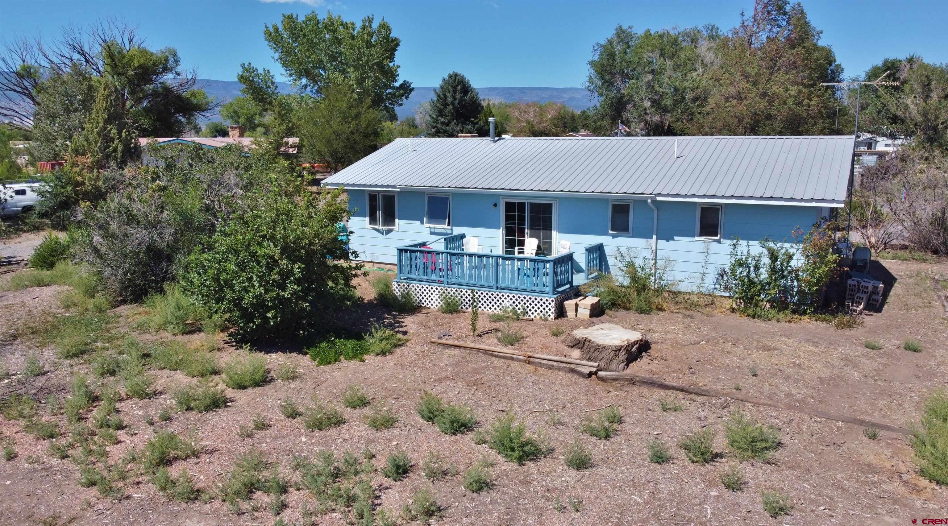 12303 West Spring Circle Eckert, CO 81418 - Photo 21 of 26 a backyard of a house with a table and chairs