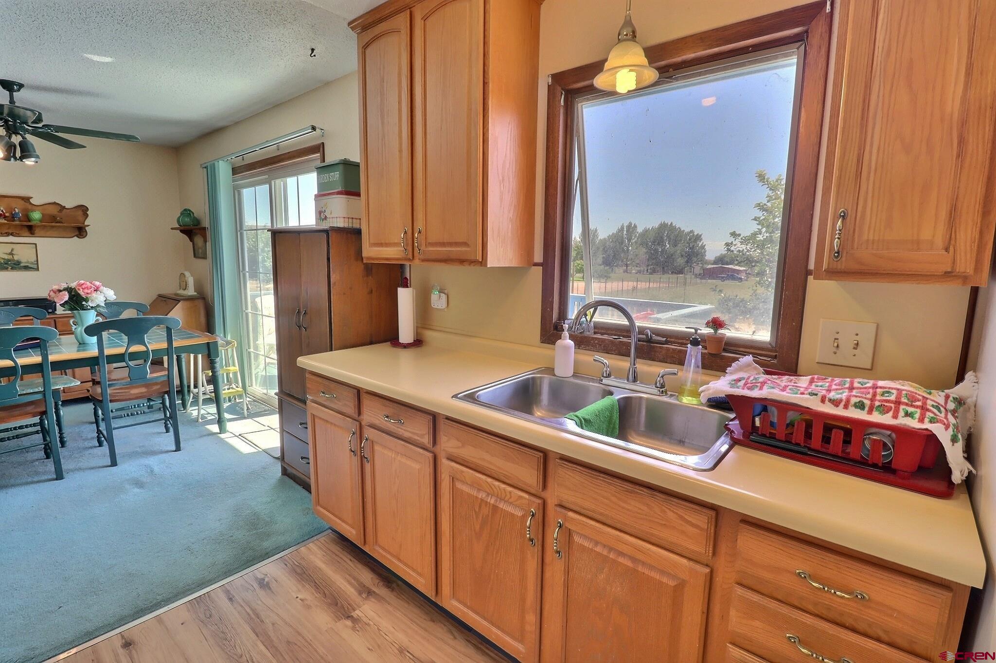 12303 West Spring Circle Eckert, CO 81418 - Photo 6 of 26 a kitchen with sink and refrigerator
