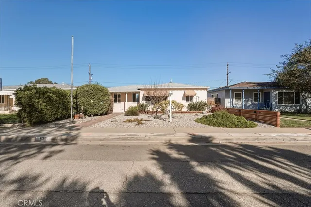 a view of a house with a street